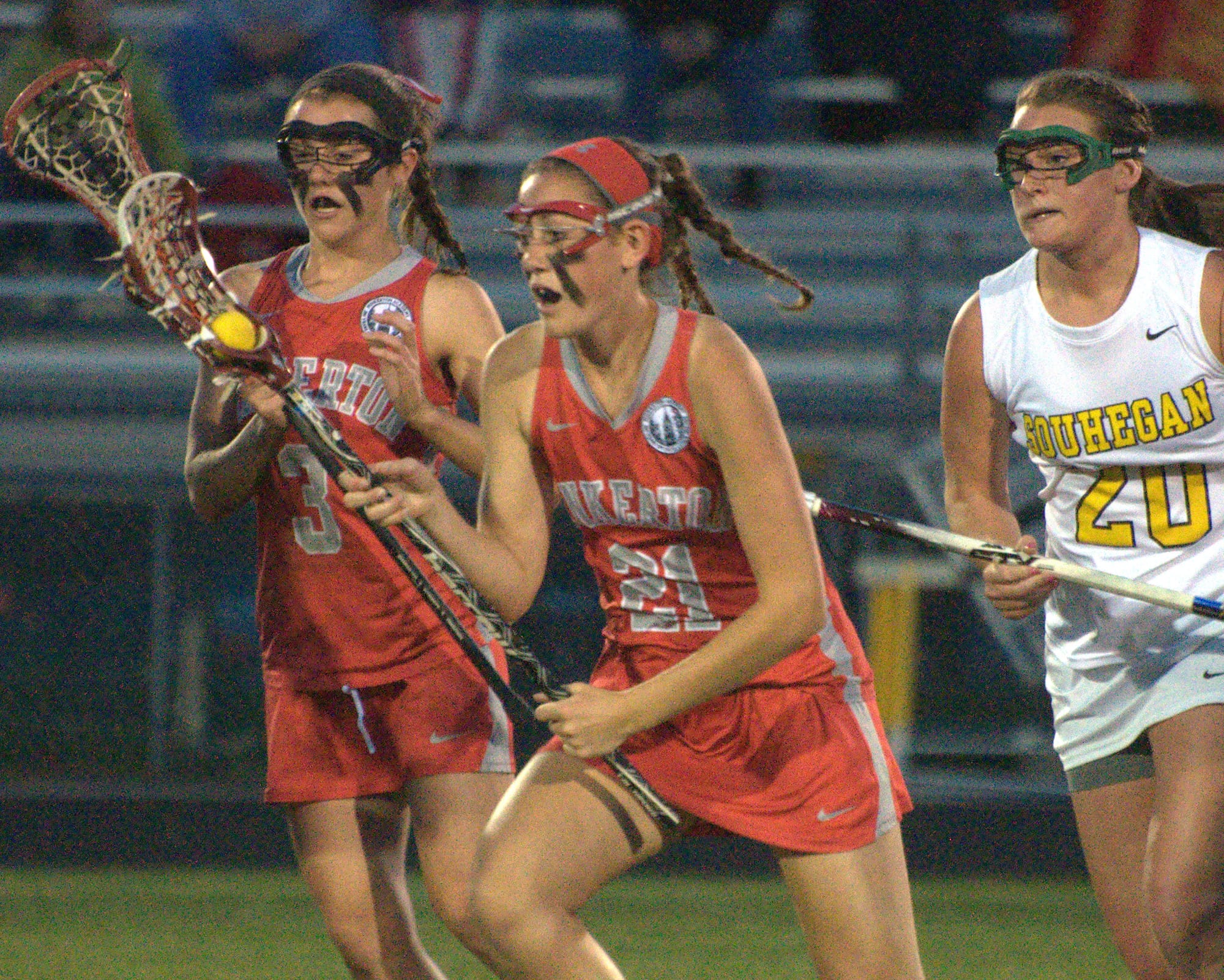 Pinkerton's Alison Davis runs with the ball after winning the draw during Thursday's game.
