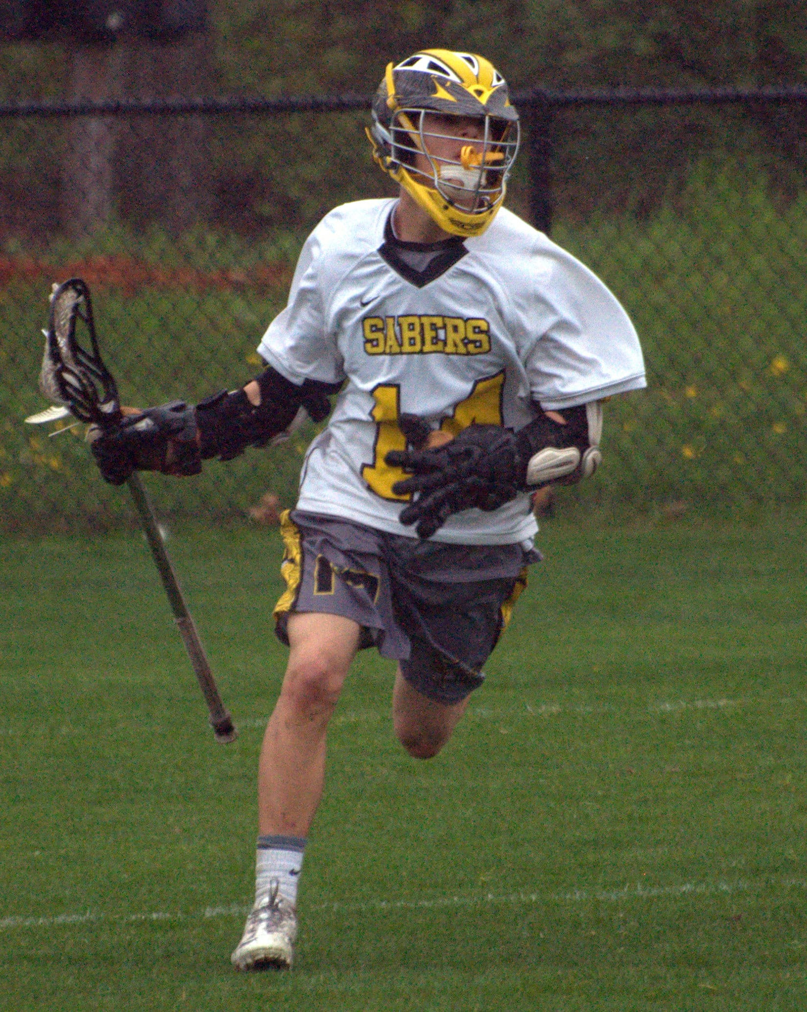 Souhegan's Brendan Cray brings the ball down the field.