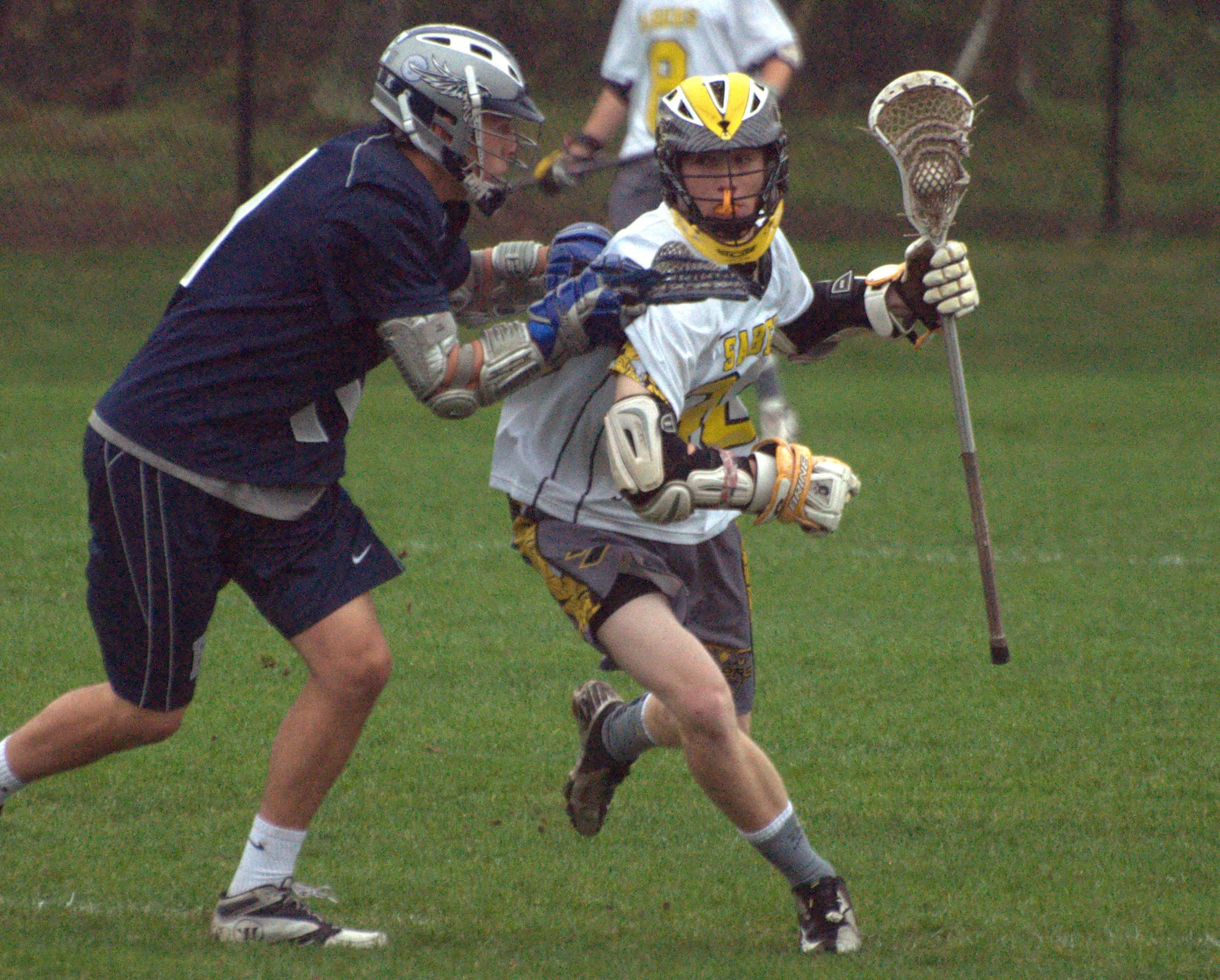 Souhegan's Blake Brunley tries to get by Exeter's Brandon Mello during Friday's game.