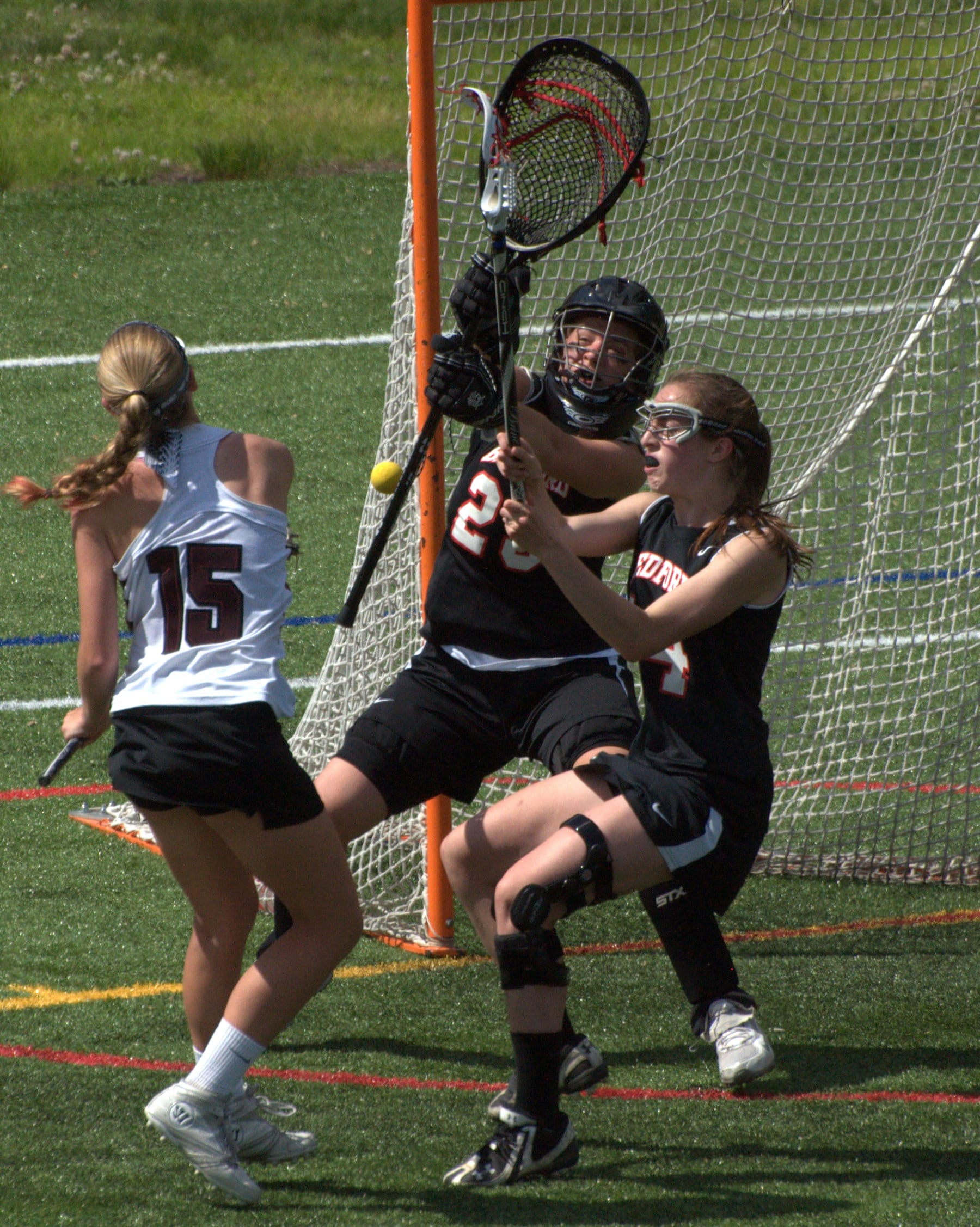 Bedford's Ashley Maddox makes a save on a shot by Hanover's Johanna Copeland.