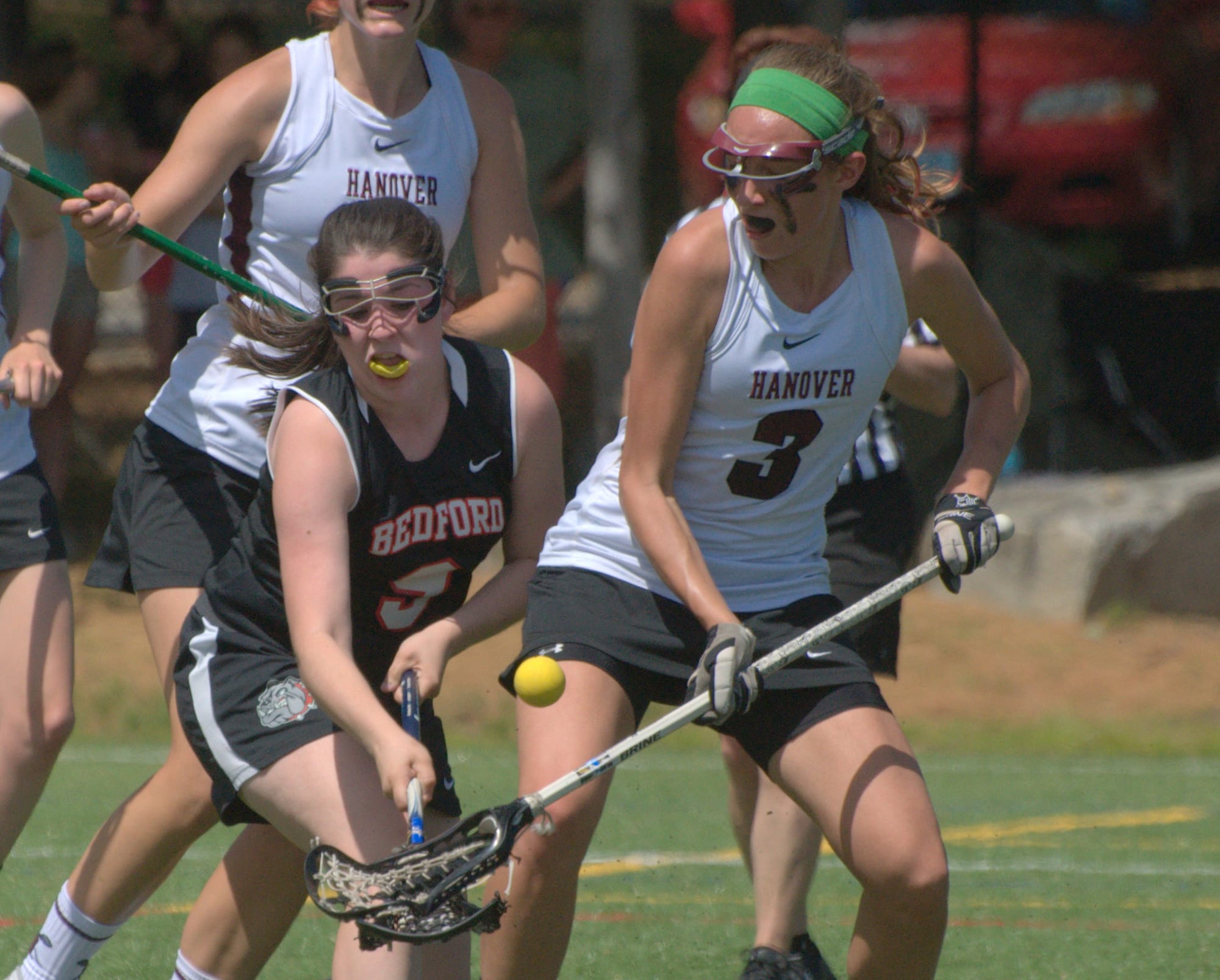 Bedford's Kristen Barnett and Hanover's JJ Daniell battle for the ball.