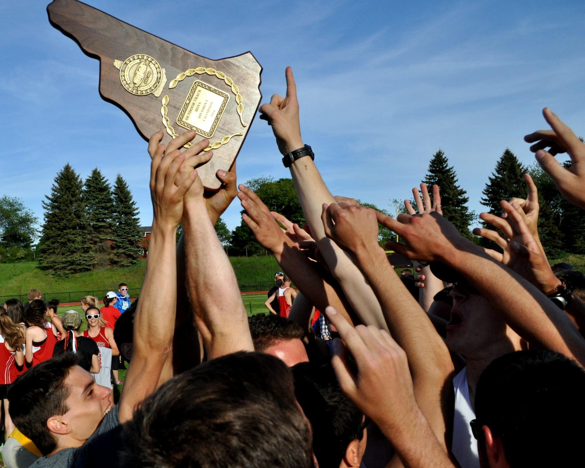 Members of the Pinkerton boys track team celebrate after winning the Division I title. For more photos, go to the Photo Album.