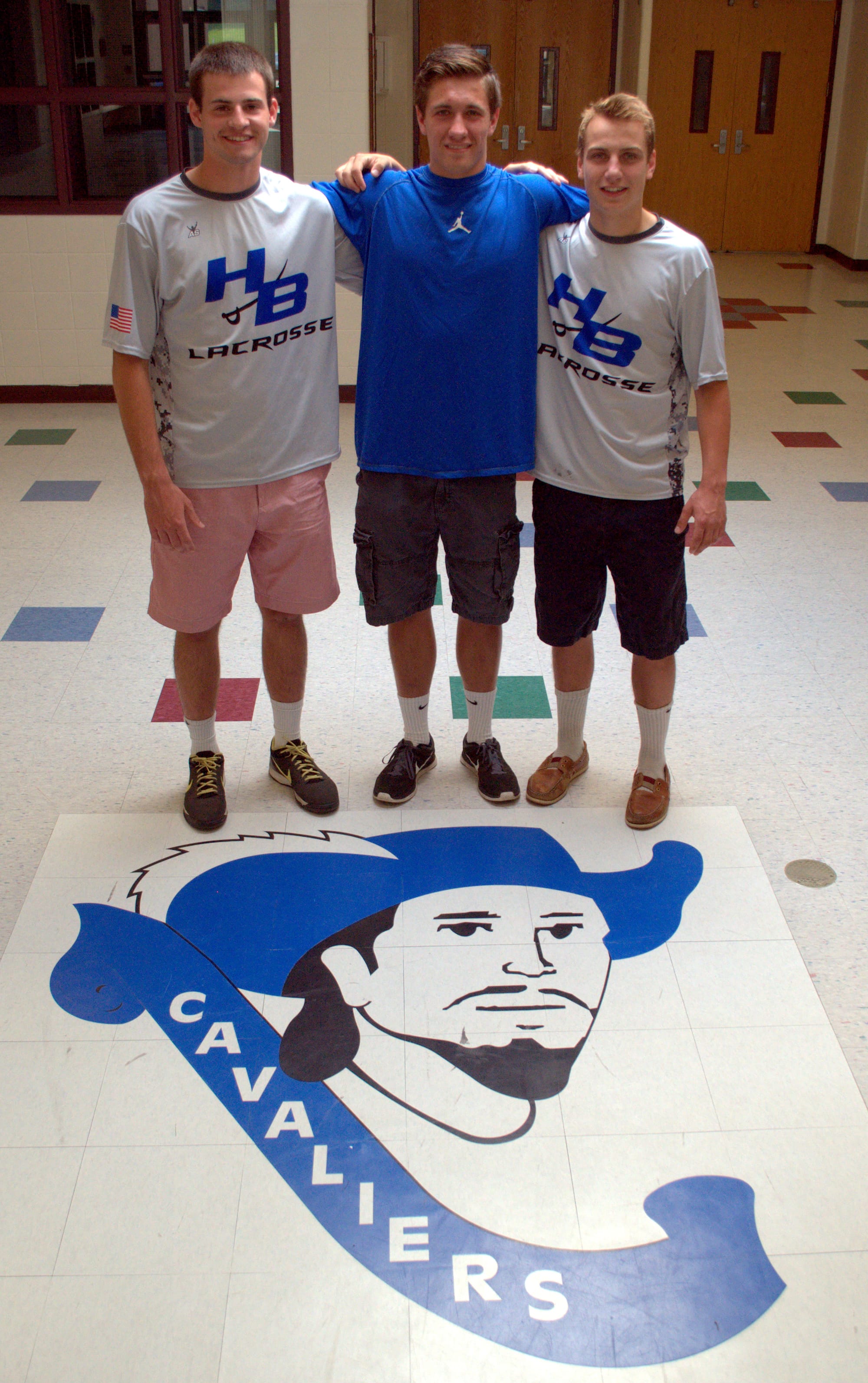 From left, Hollis Brookline's Logan Blake, Ryan Papineau and Joe Brooks.