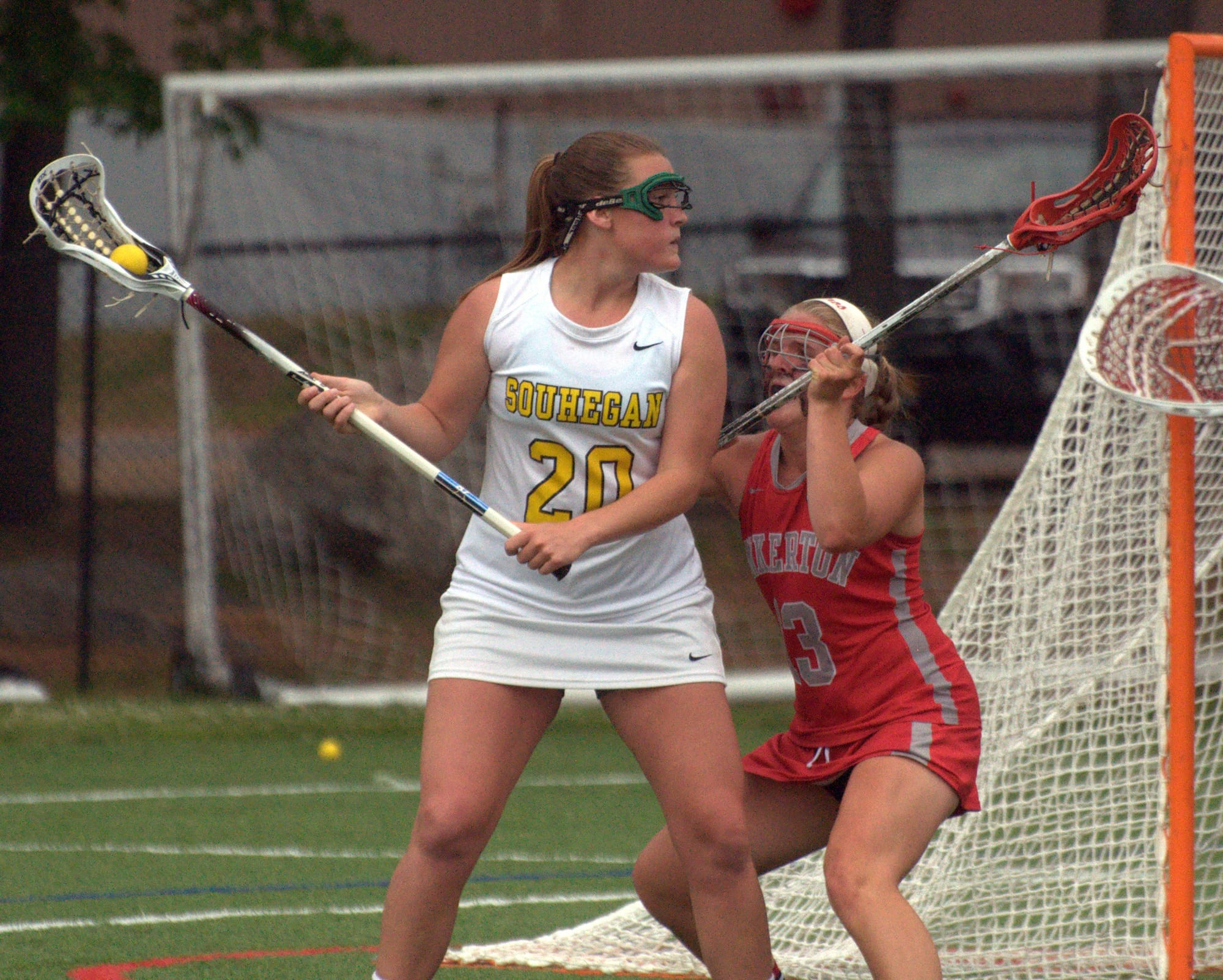 Pinkerton's Kristen Sobolewski plays defense against Souhegan's Mickenzie Larivee during Tuesday's game. For more photos, go to the Photo Album.