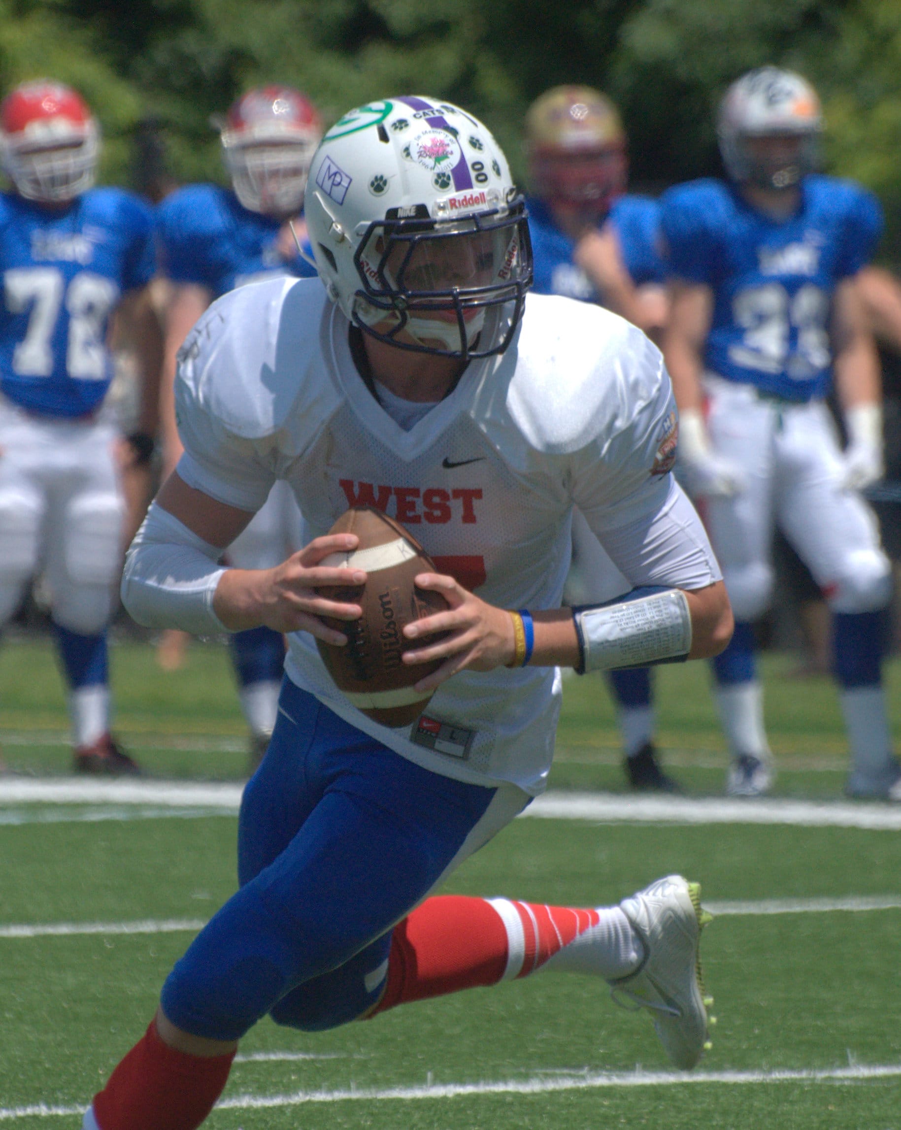 West quarterback Trevor Knight rolls out as he looks for a receiver.