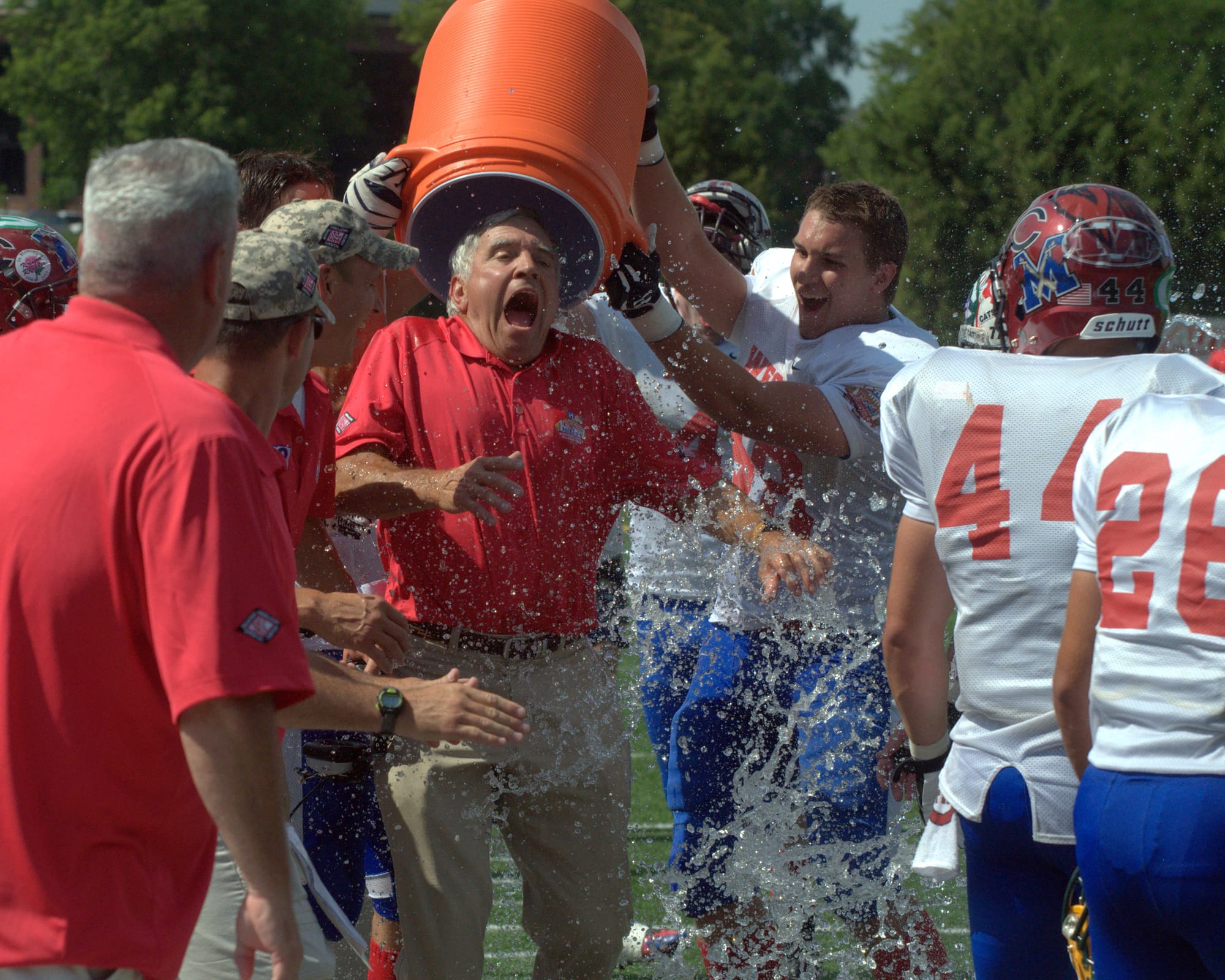 West coach Paul Lavigne gets a celebratory ice bath after his team defeated the East in the CHaD East-West NH High School All-Star Game.