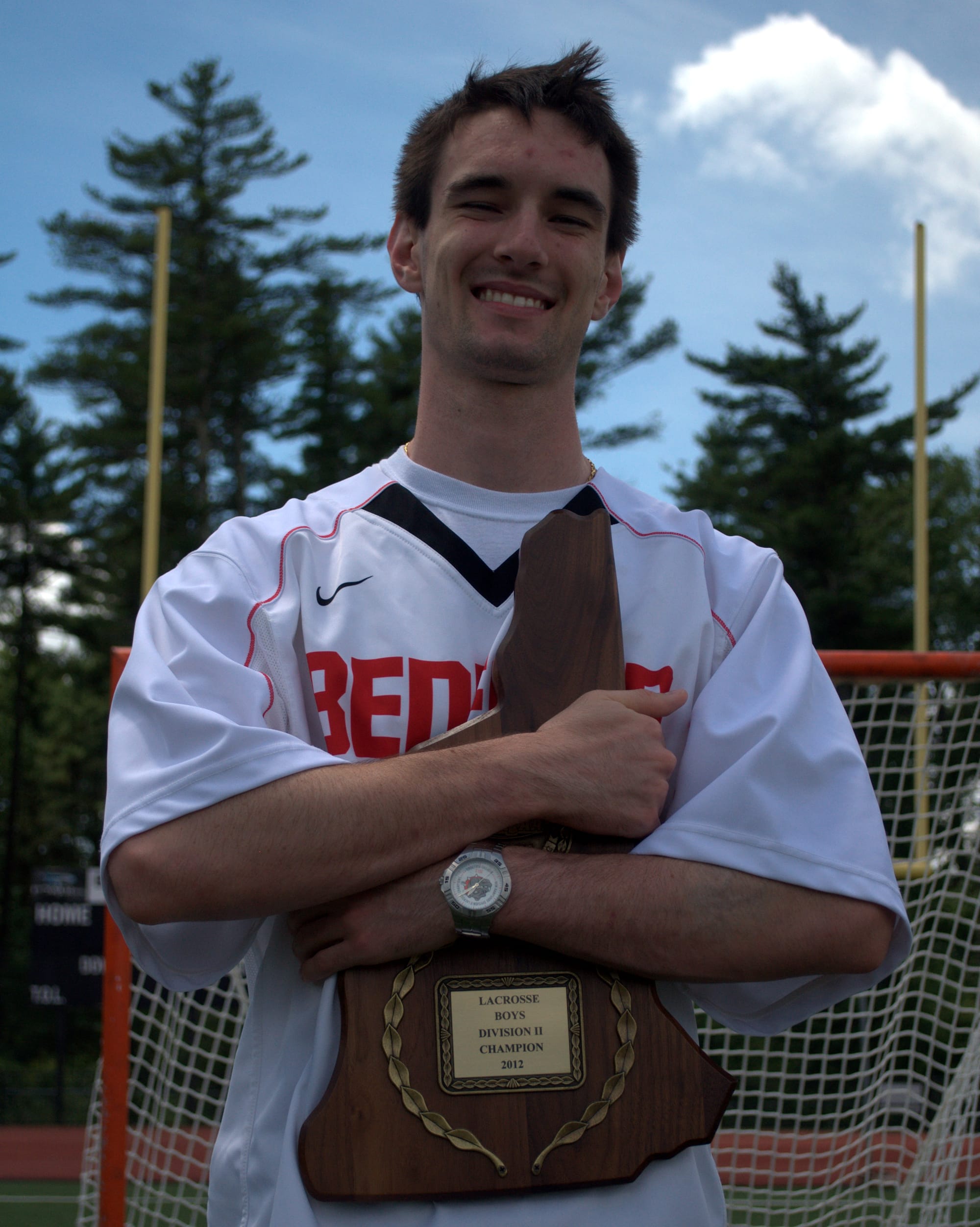 Dan Colella and the 2012 Division II championship plaque.