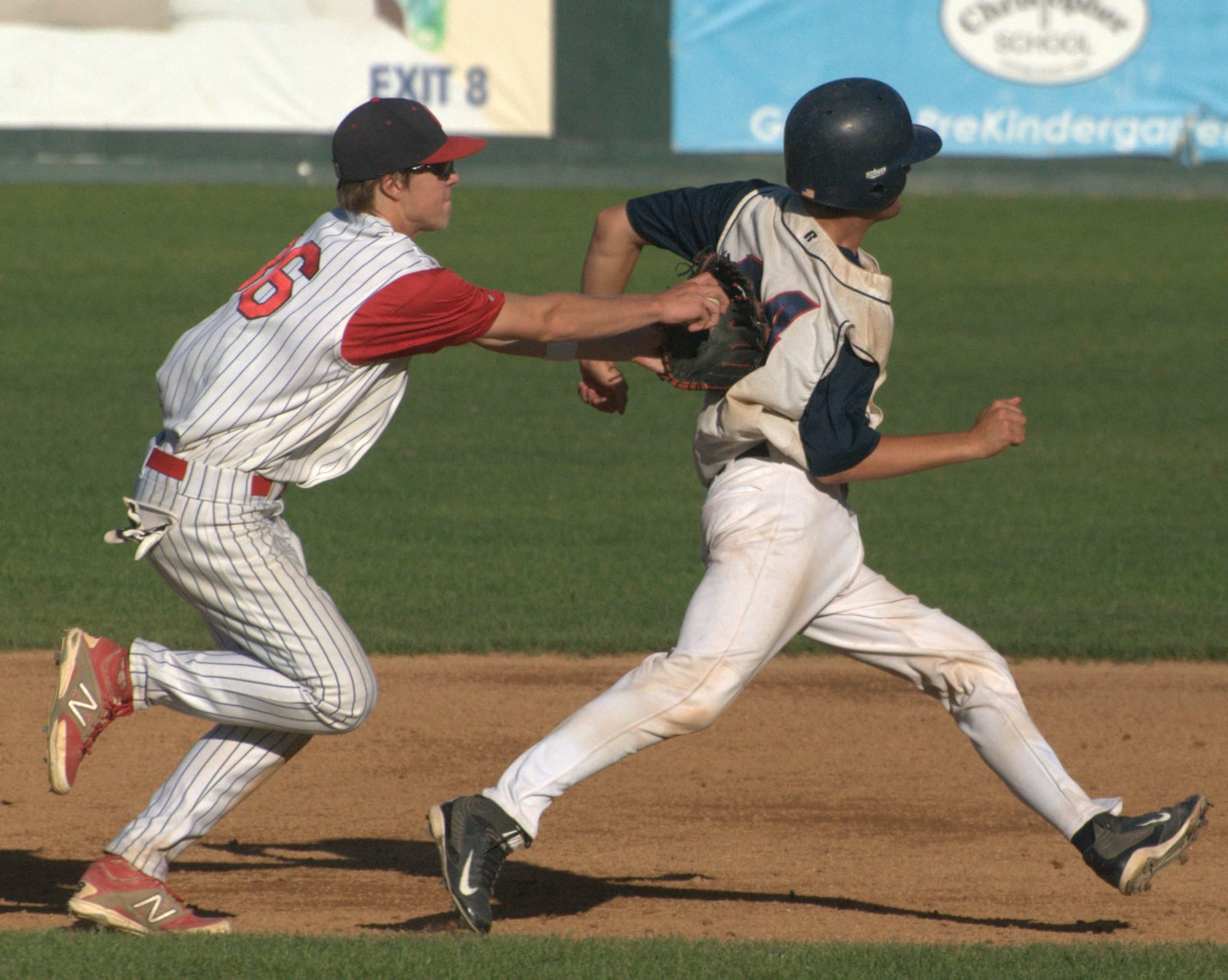 Concord's Chapin Bassi tags Dover's Connor Rittenhouse.