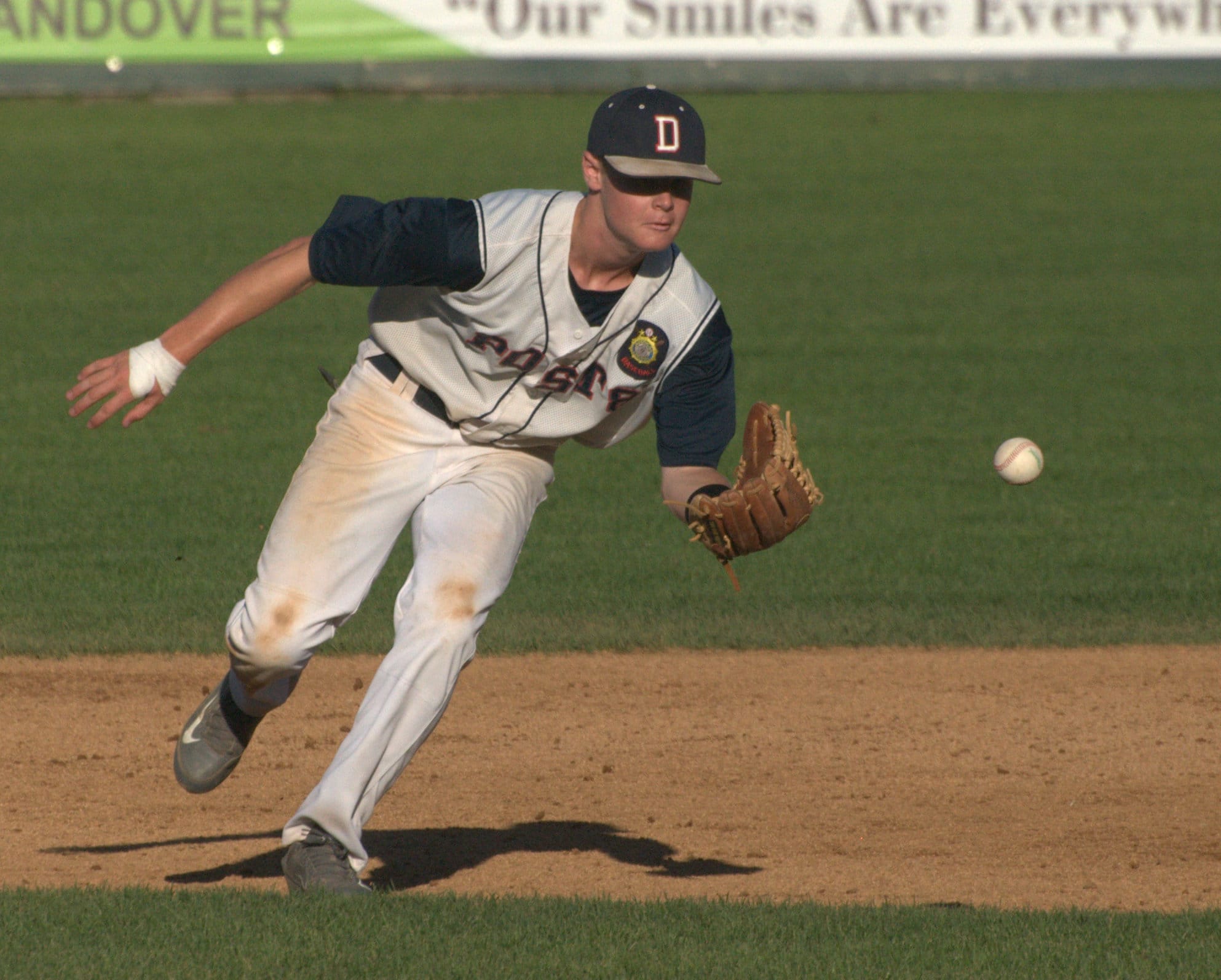 Dover's JT Bishop tracks down a groundball during Thursday's game against Concord.