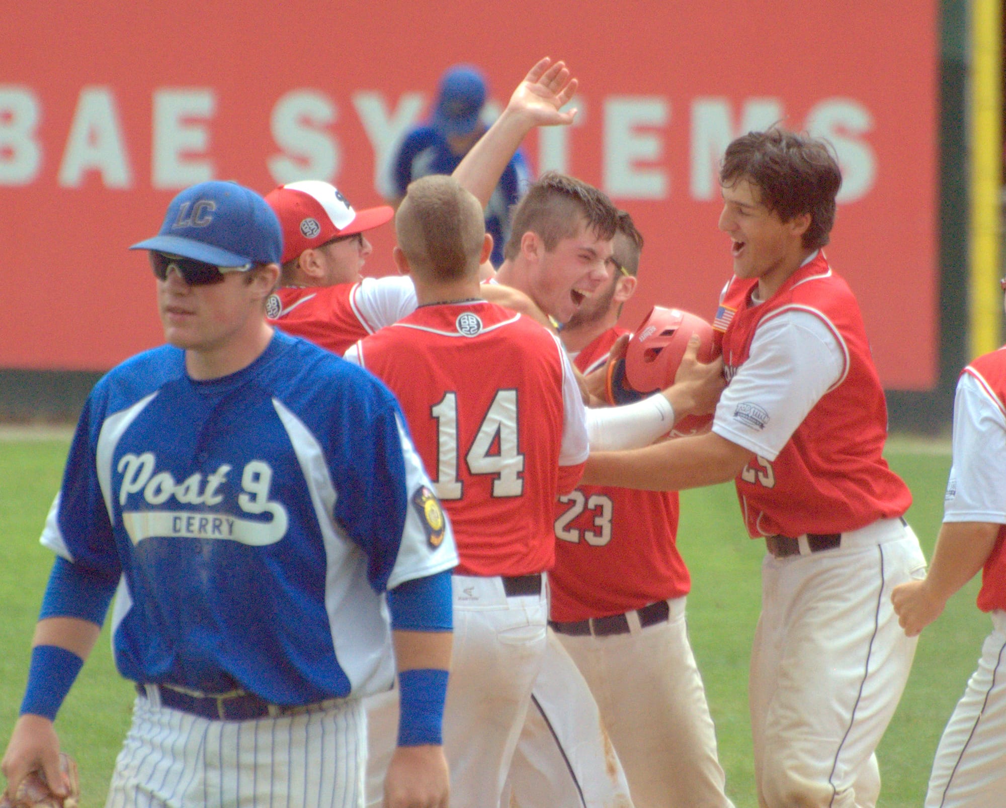 Lebanon players mob teammate Ben Robinson, center, after his walkoff single to beat Derry in Thursday's game.