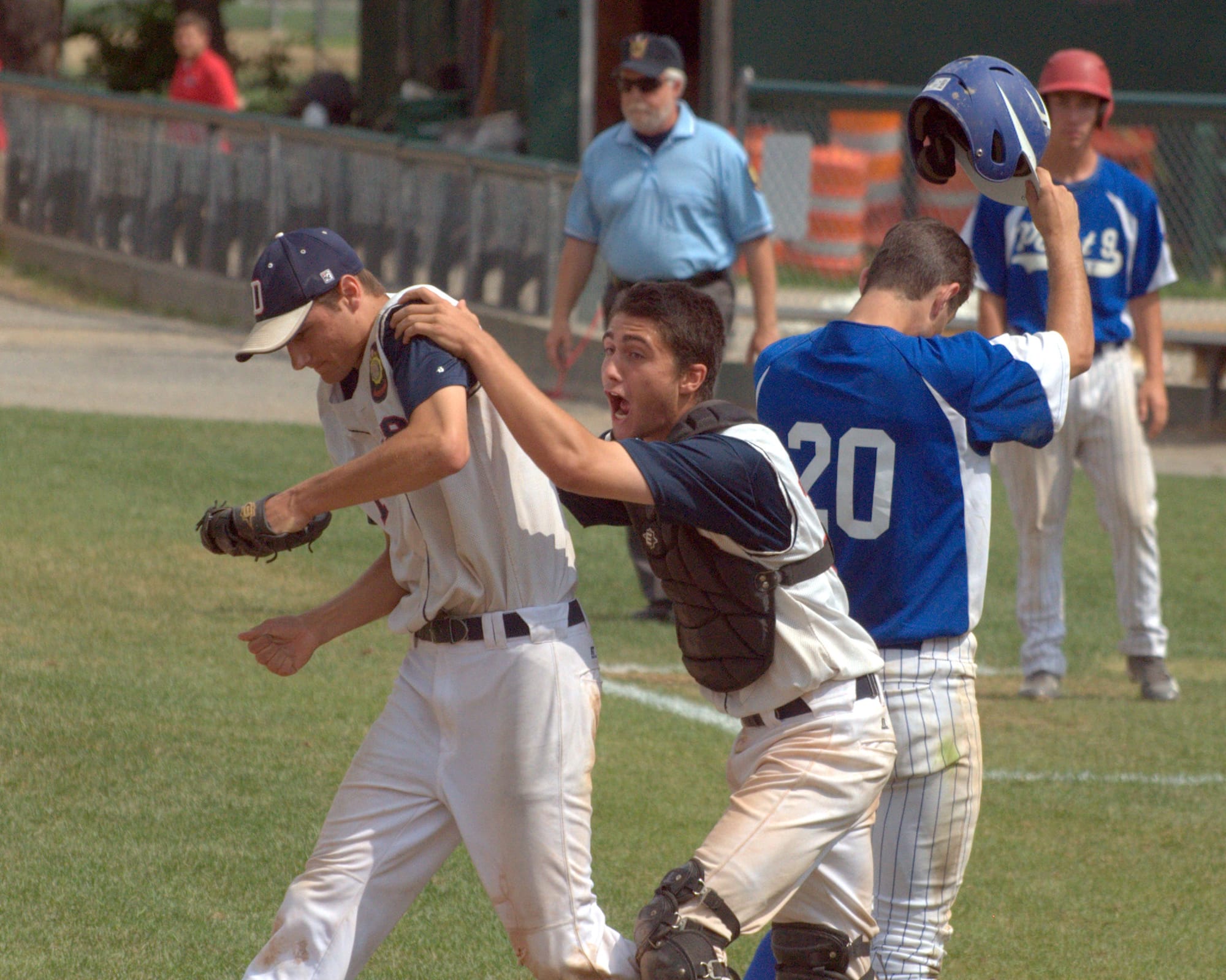Dover's Connor Rittenhouse celebrates with Aaron Denis after Derry's Mike Albetski made the final out of Tuesday's title game.