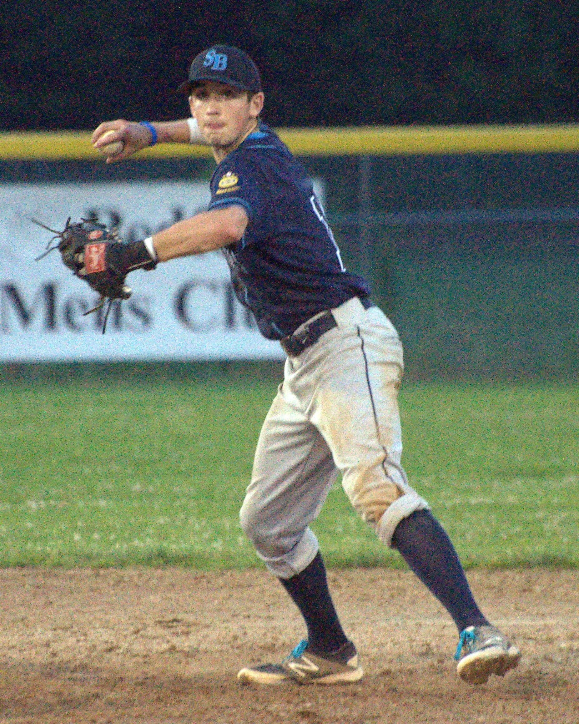 Bedford's Ryan Lang makes a throw to first base.