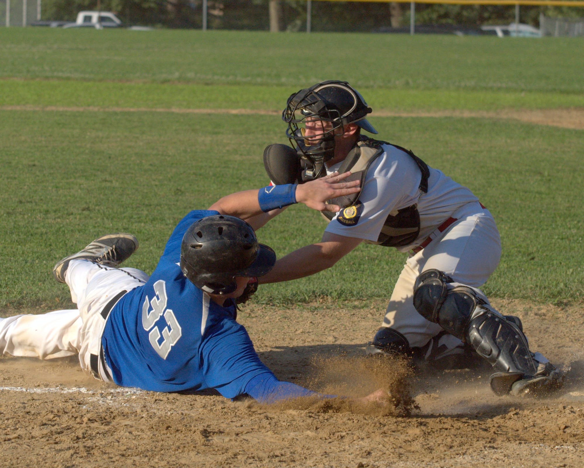 Milford's Cam Douglas tags out Goffstown's David Nelson during Thursday's game. For more photos, go to the Photo Album.