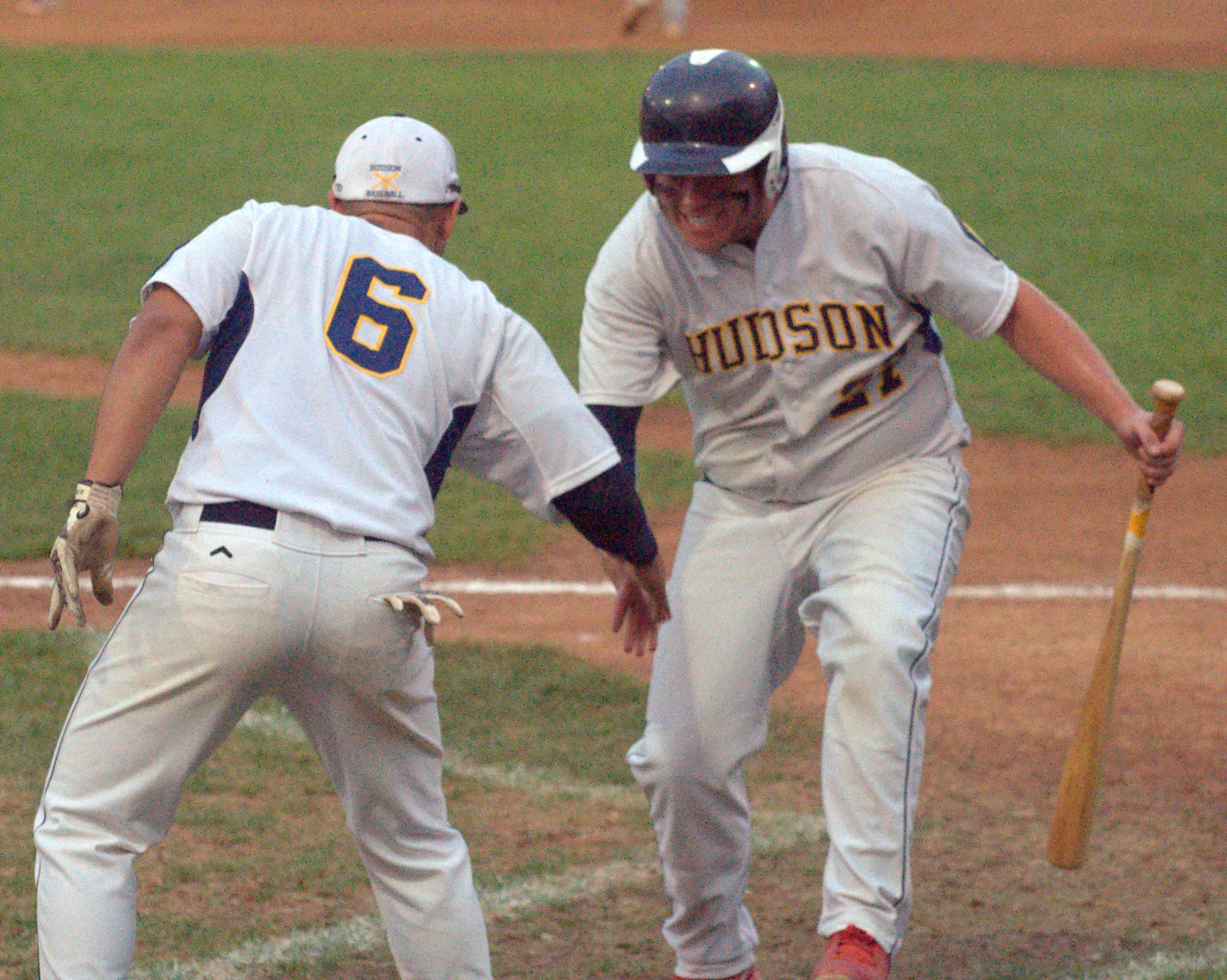 Hudson's Luis Matrille, left, and Dakota Williams celebrate a run during Friday's game against Rochester.
