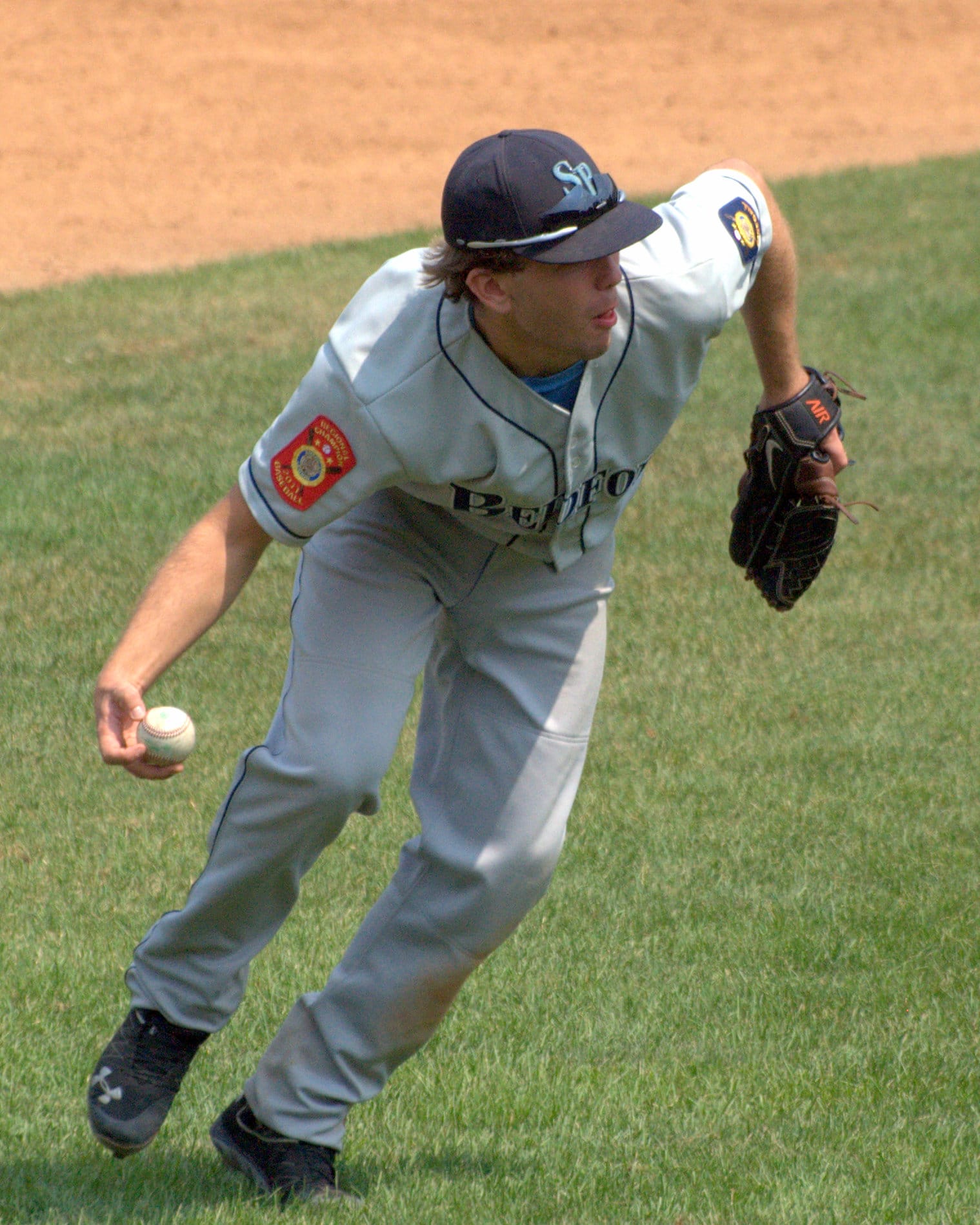 Bedford's Michael Kernan scoops up a groundball.