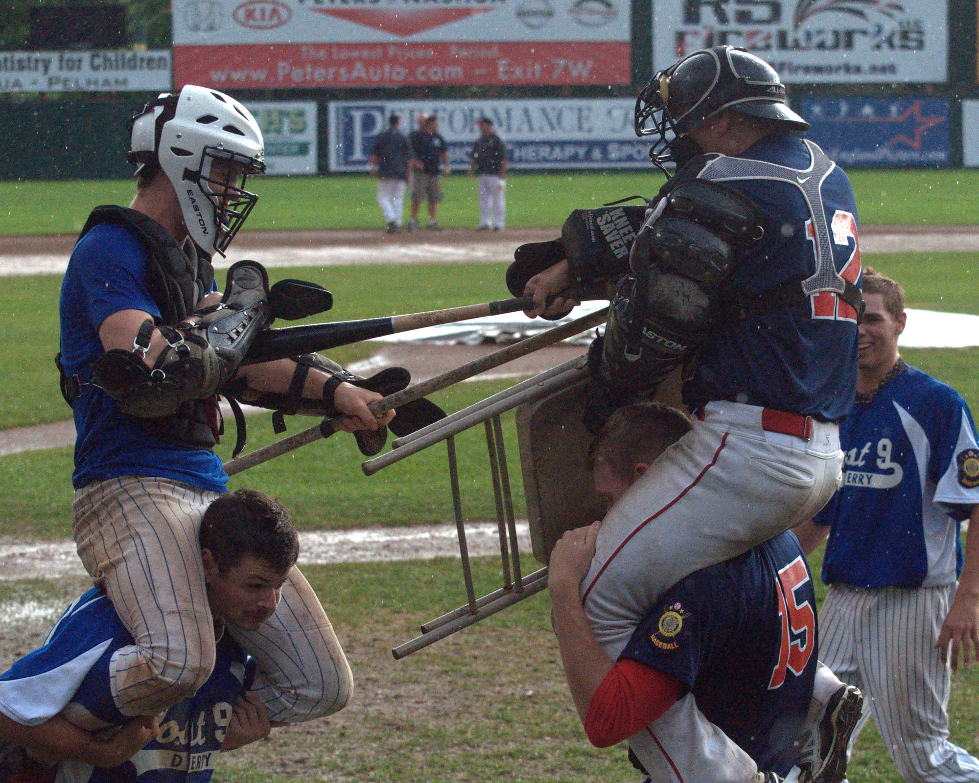 Players from both teams keep themselves occupied during Monday's rain delay.