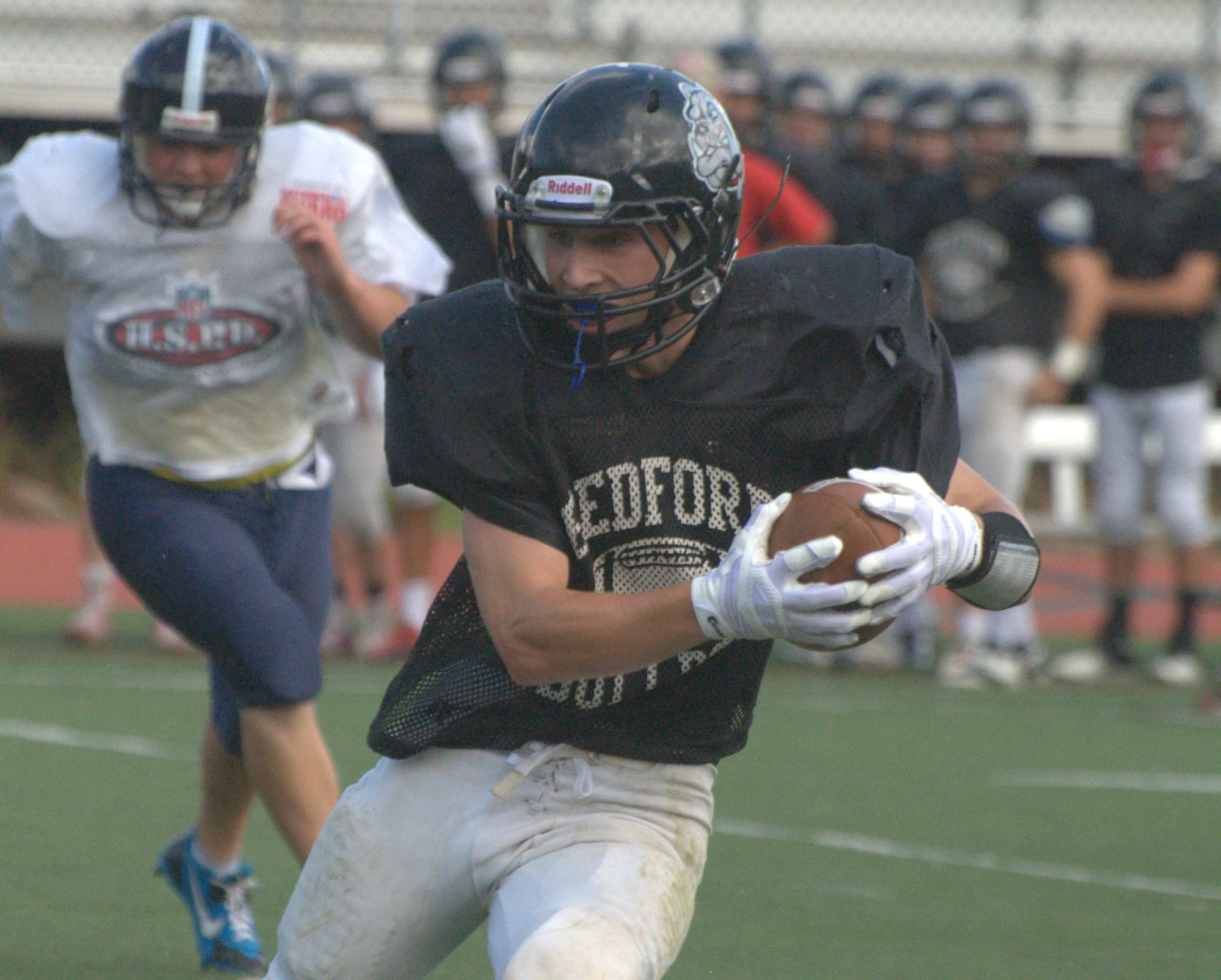 Bedford's Colin Cashin turns upfield after catching a pass.