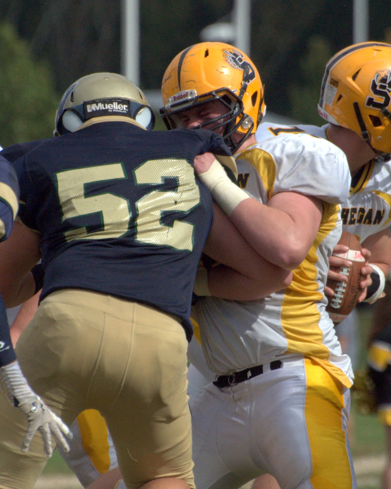 Souhegan's George LePage throws a block during a game last year.