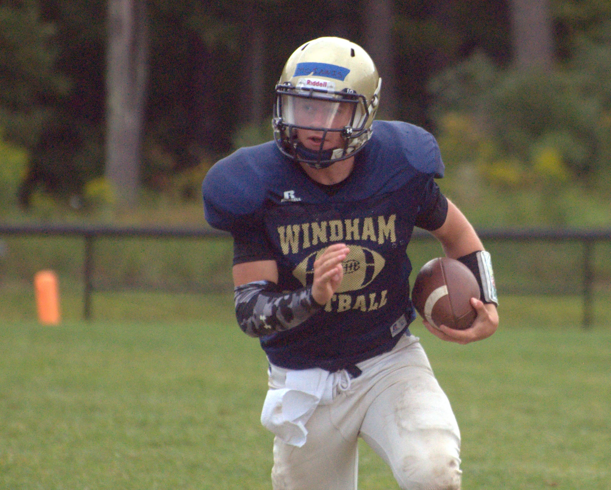 Brendan McInnis runs with the ball during Windham's joint practice with Merrimack on Thursday.
