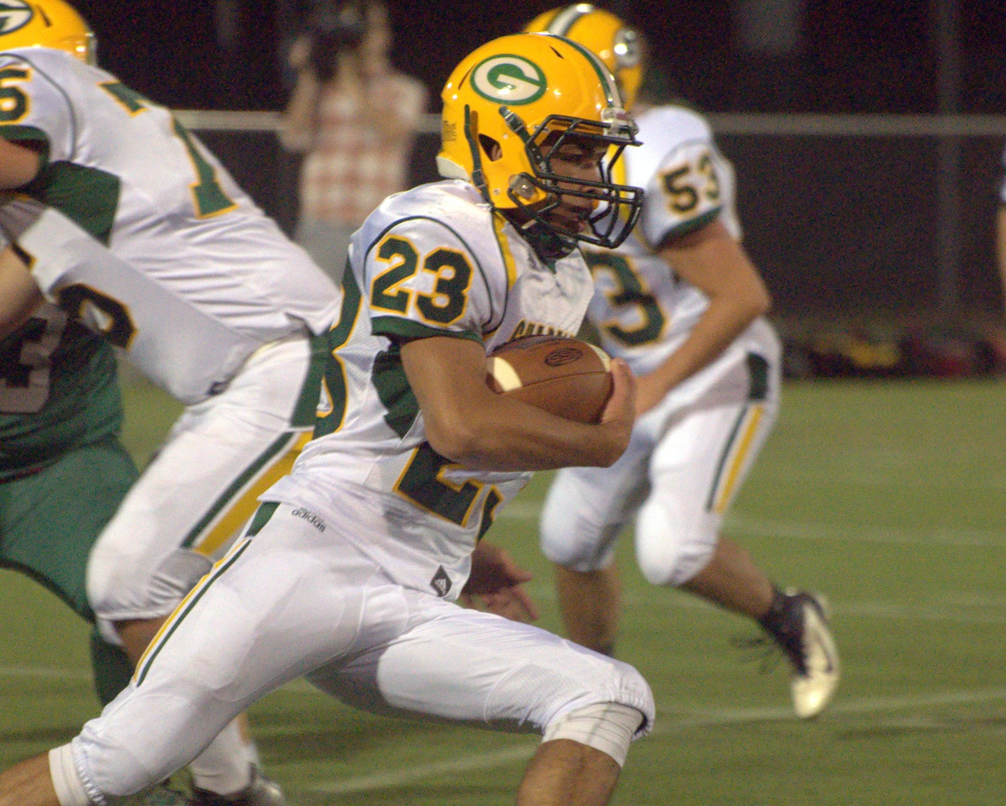 Bishop Guertin's Kelvin Rivera carries the ball during Friday's scrimmage against Manchester Central.