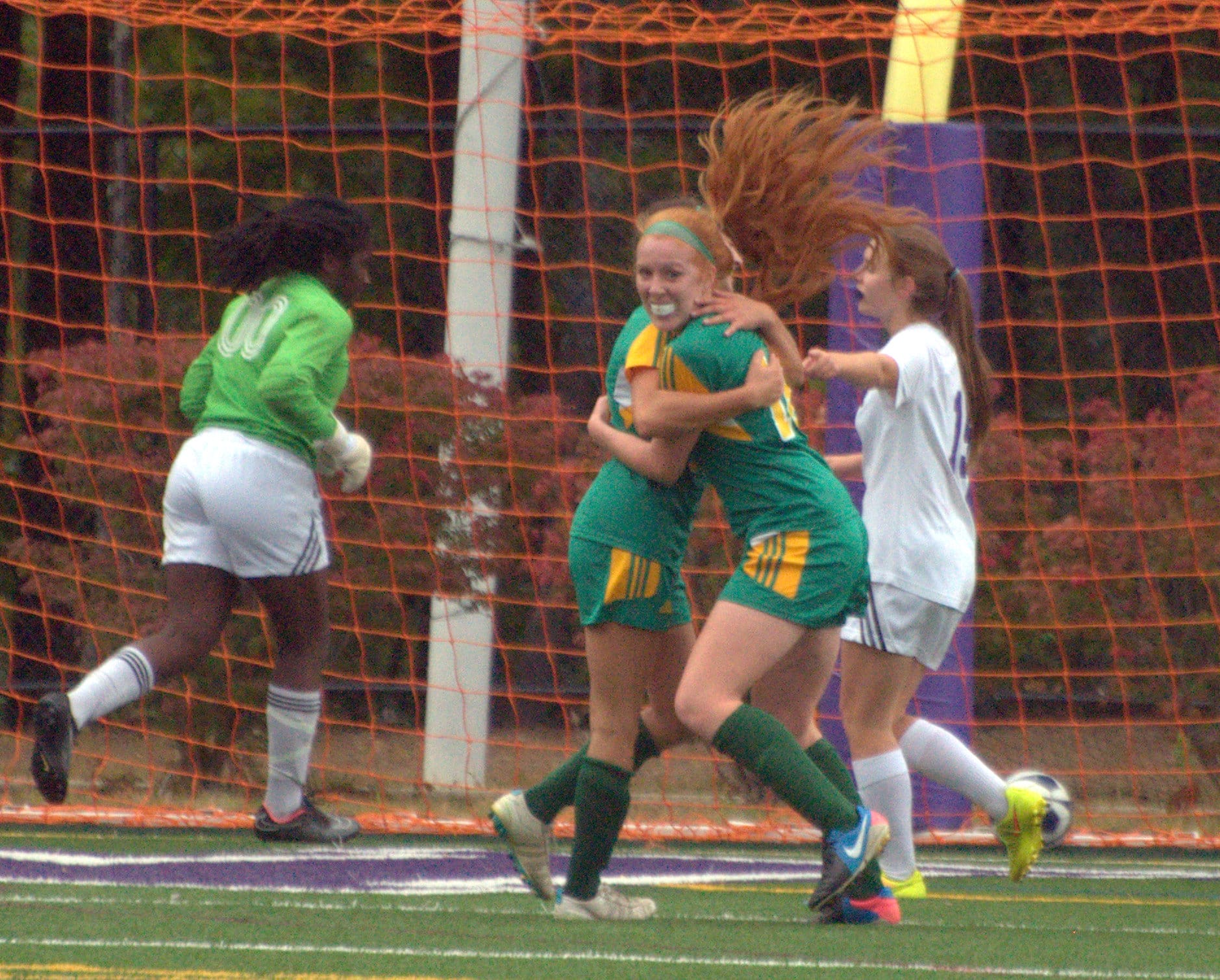 Bishop Guertin's Kiley Deignan with a teammate after scoring a goal during Tuesday's game against Nashua South.
