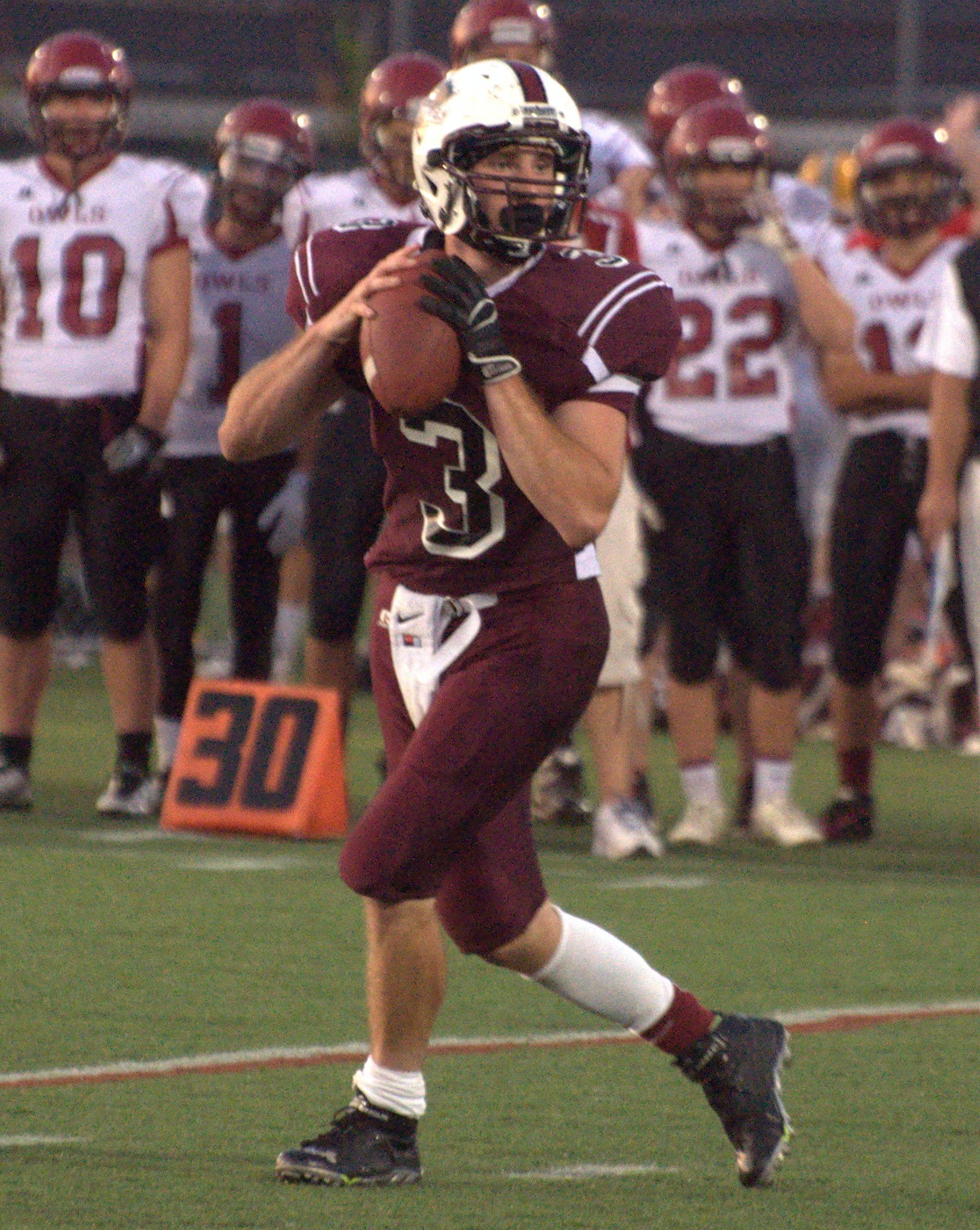 Goffstown quarterback Matt Collins looks for a receiver.