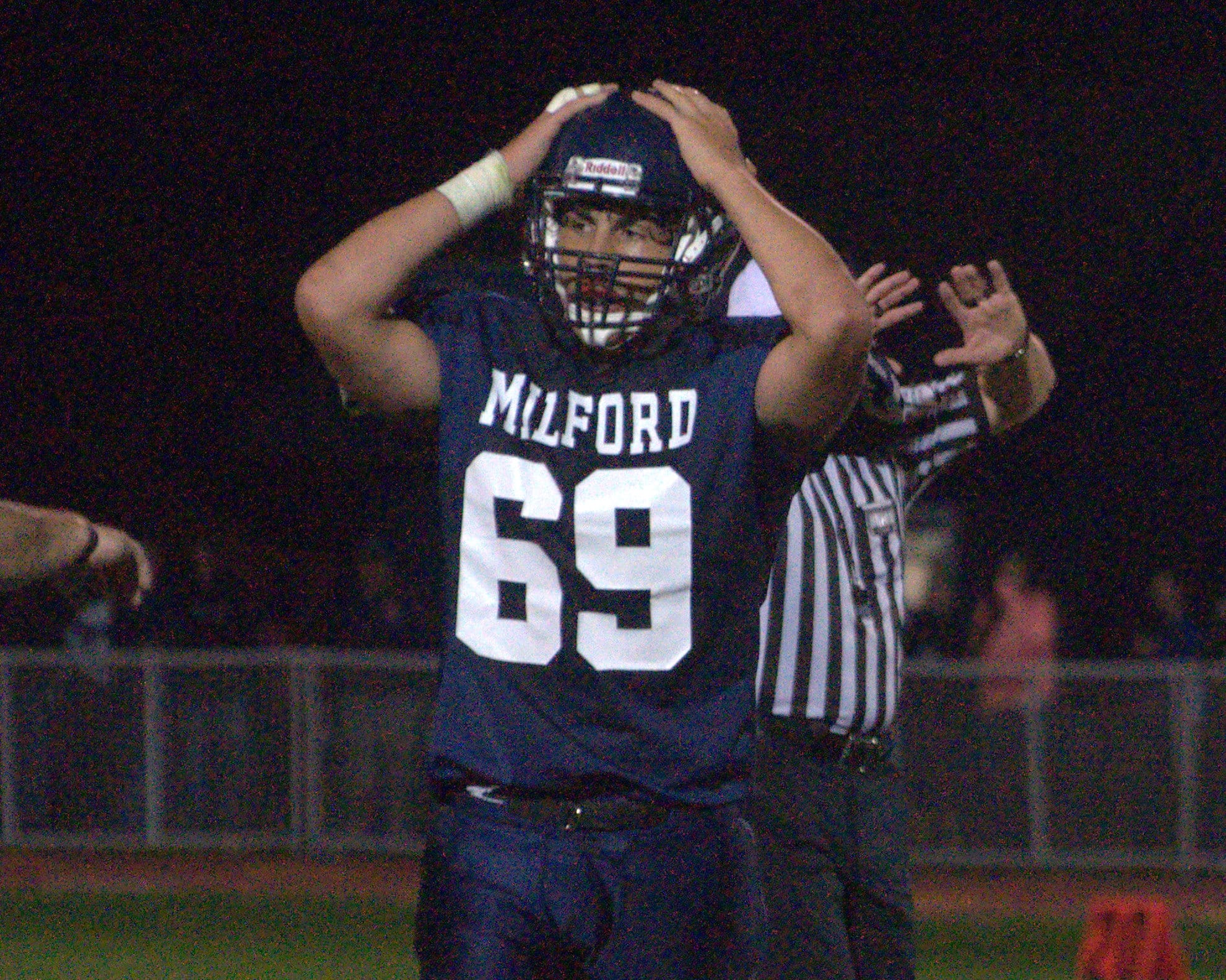 Milford's Dillon Burdick reacts after the Spartans turned the ball over in the fourth quarter Friday.