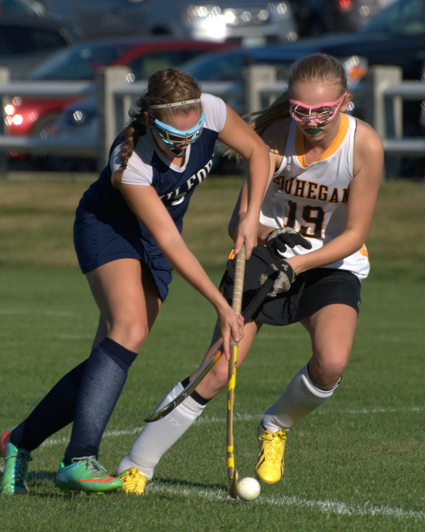 Milford's Lauren Dishong tries to get by Souhegan's  Natalie Nelson.