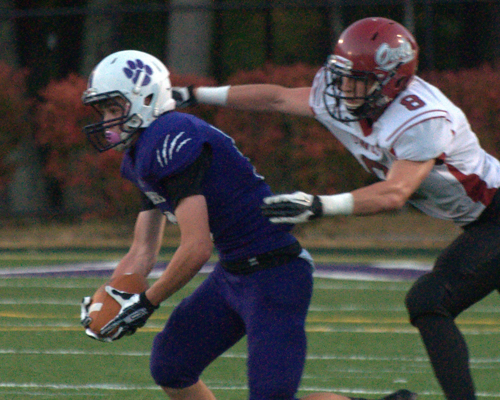 Nashua South's Robbie Smyth tries to escape a tackle during a game last season.