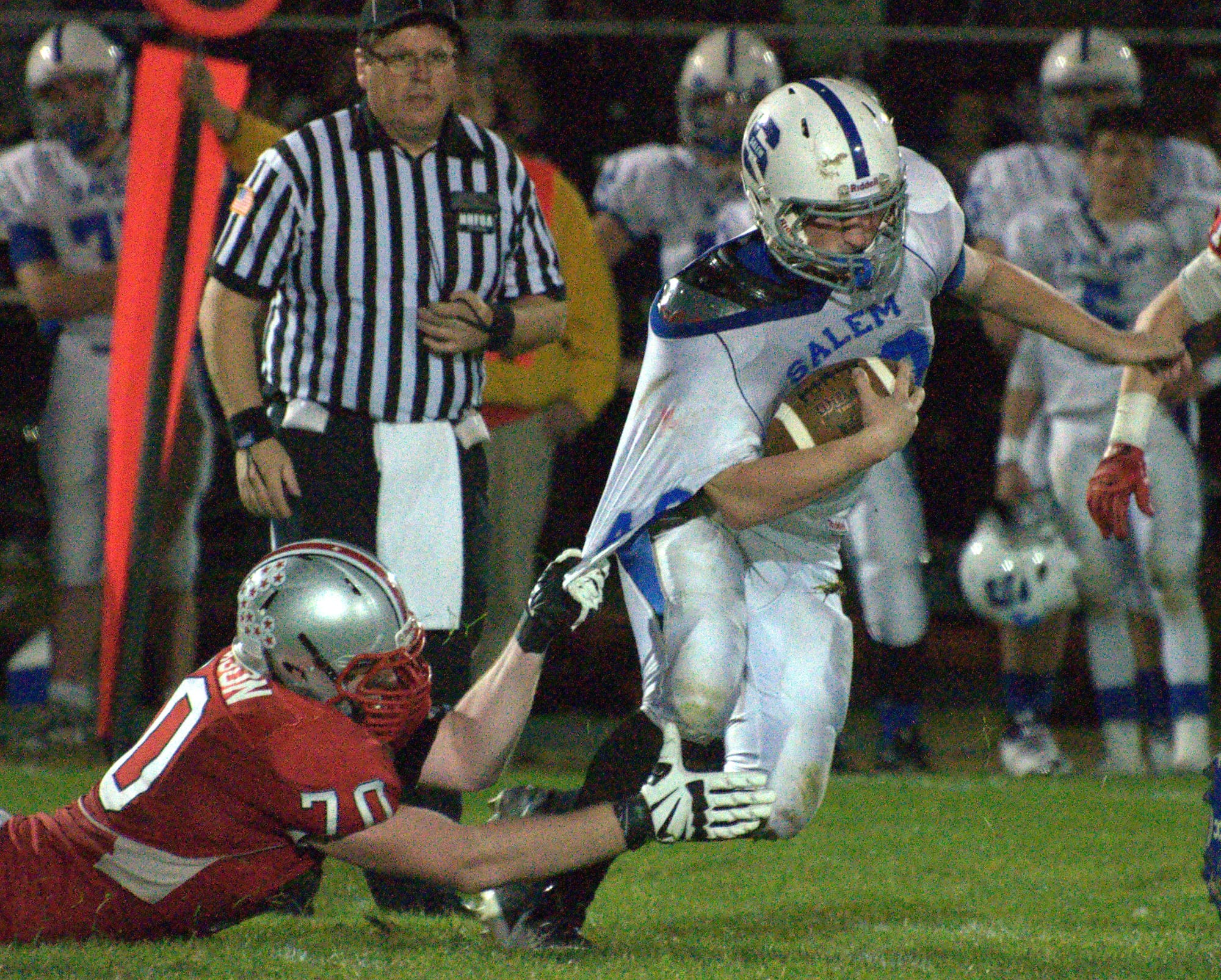 Pinkerton's Noah Robison tries to bring down Salem's Johnny Bartose during Saturday's game.