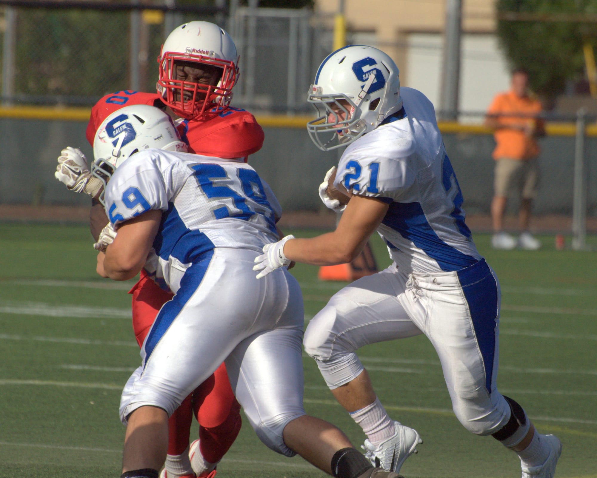 Salem's Austin Ribaudo, left, throws a block for Matt Loffredo during Friday's scrimmage against Trinity.