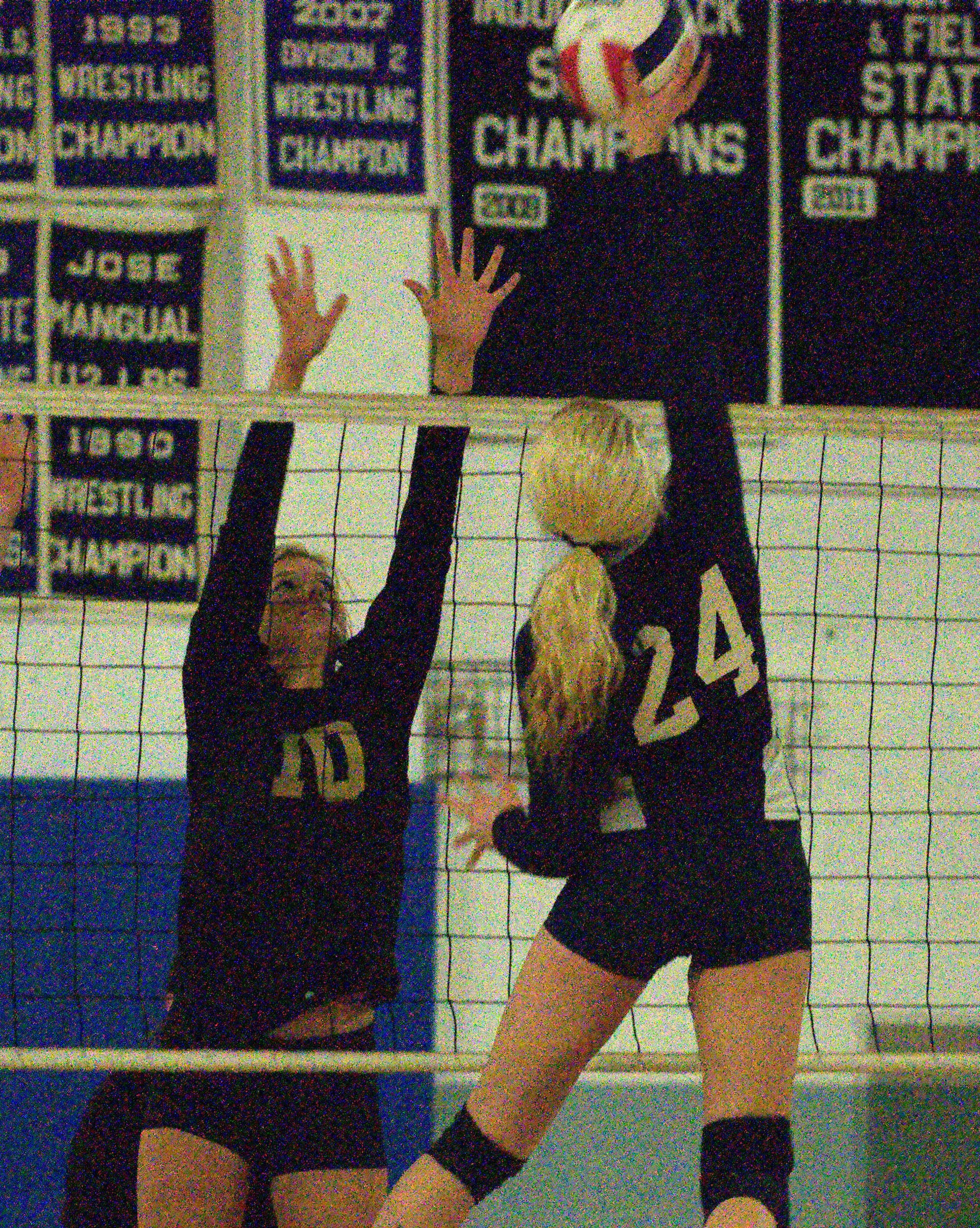 Windham's Basie Bostic tries to block a hit by Milford's Olivia Rougeau during Wednesday's match.