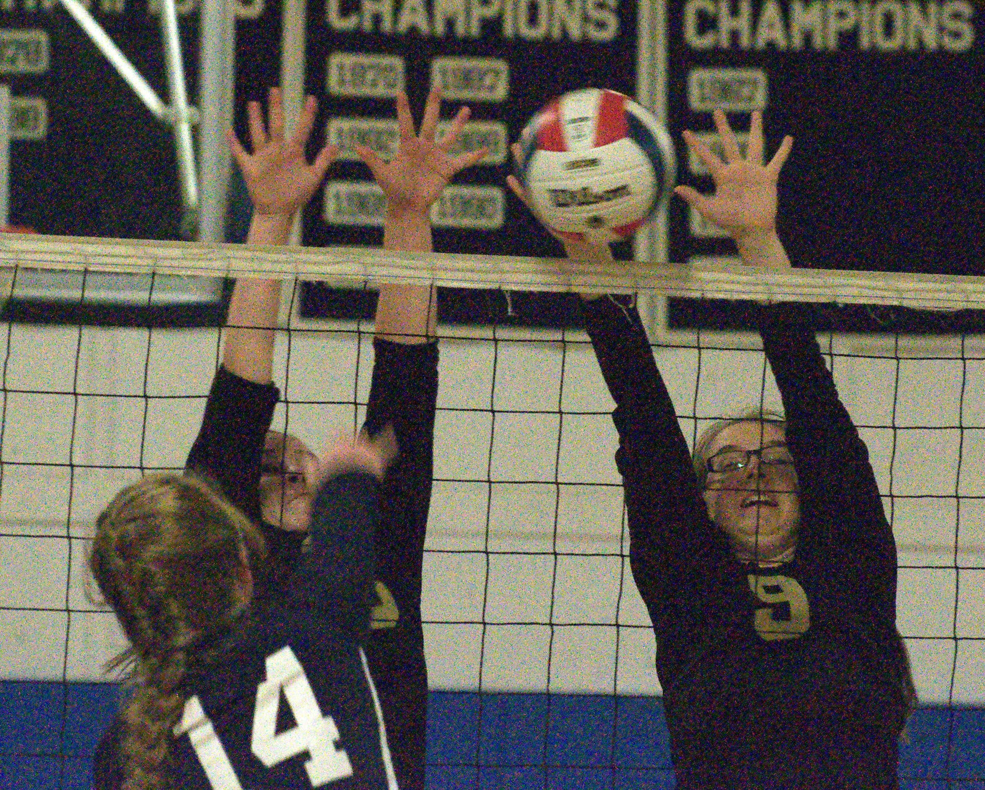 Windham's Emiline Sundman and a teammate try to block a hit by Milford's Jess Leach.