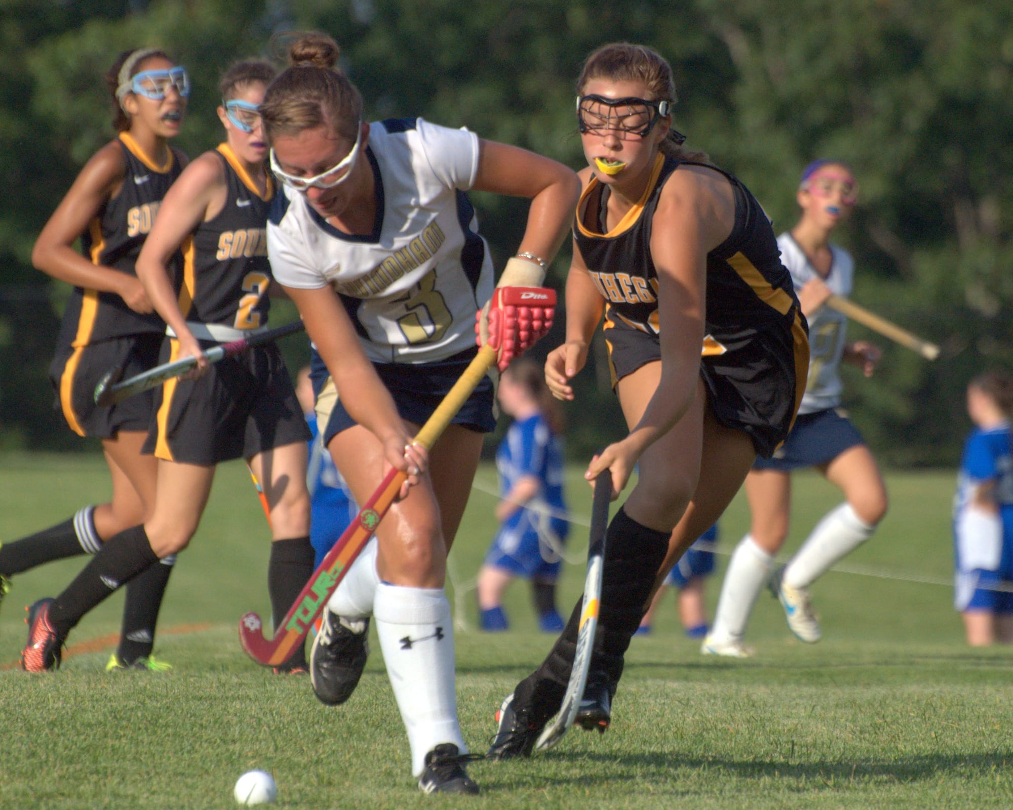 Souhegan's Timber Devine tries to slow down Windham's Rachel Lanouette during Tuesday's game. For more photos, go to the Photo Album.