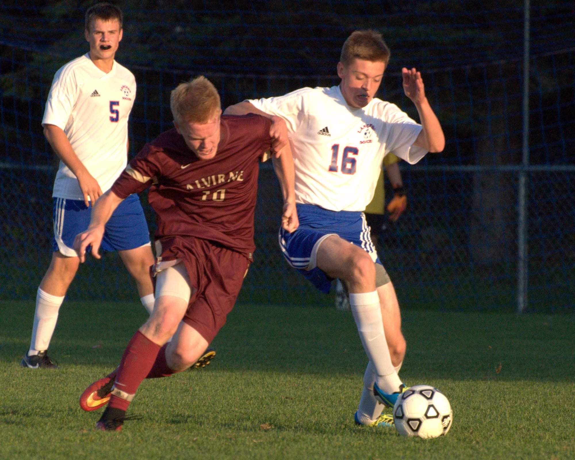 Alvirne's Brett Richarson and Londonderry's Conor O'Regan battle for the ball.