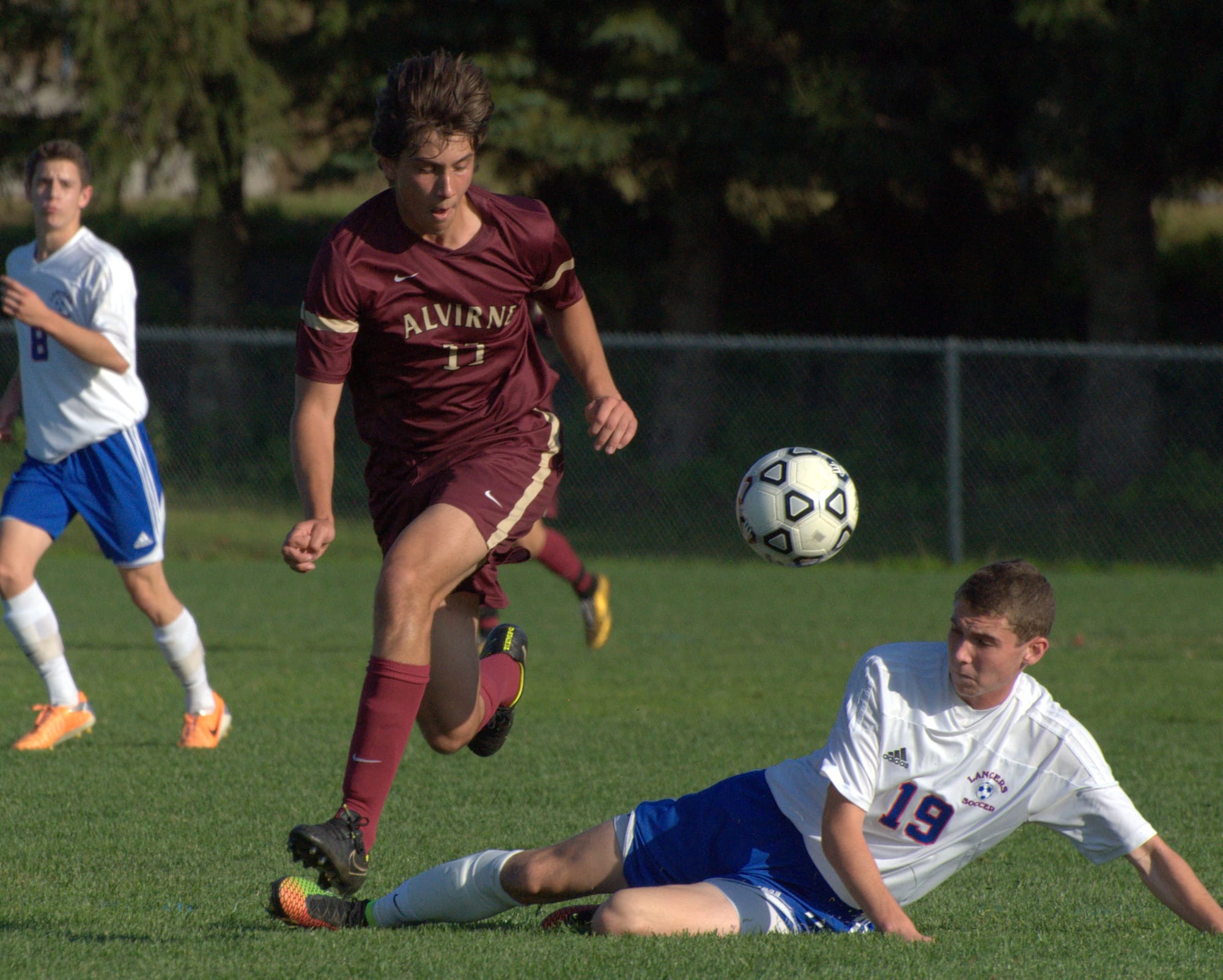 Londonderry's Max Hastings knocks the ball away from Alvirne's Raul Stedile during Monday's game.