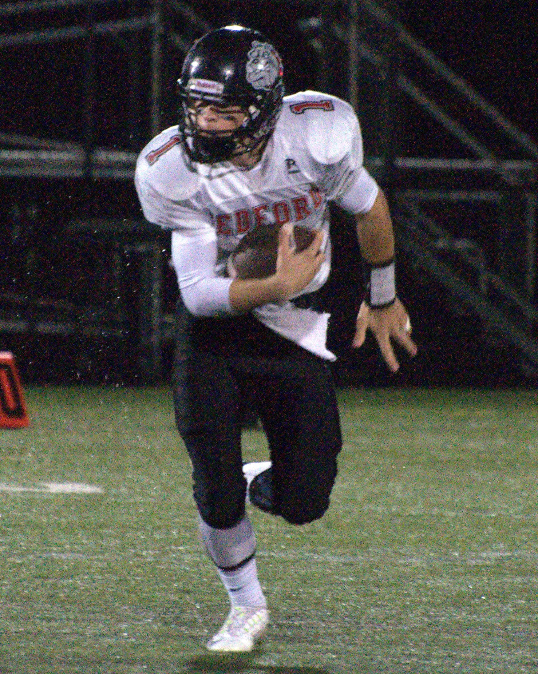 Bedford's Mike Vailas looks for room to run.