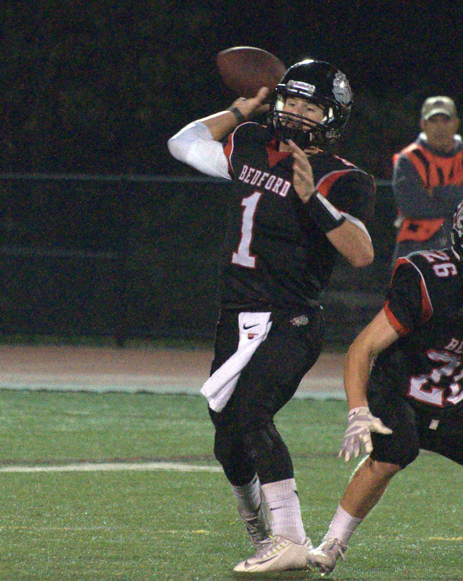 Bedford's Mike Vailas throws a pass during Friday's game.
