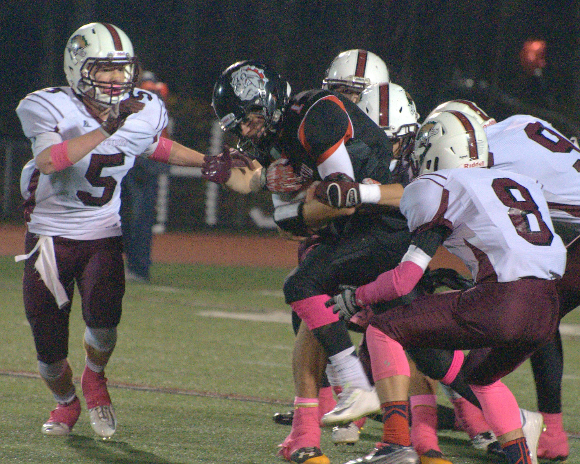 Bedford's Mike Vailas tries to fight through the Goffstown defense during Saturday's game.