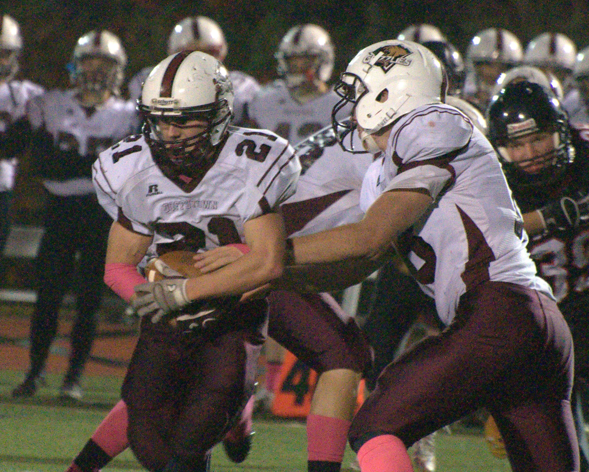 Goffstown's Connor Bourque takes a handoff from Casey Gervais.
