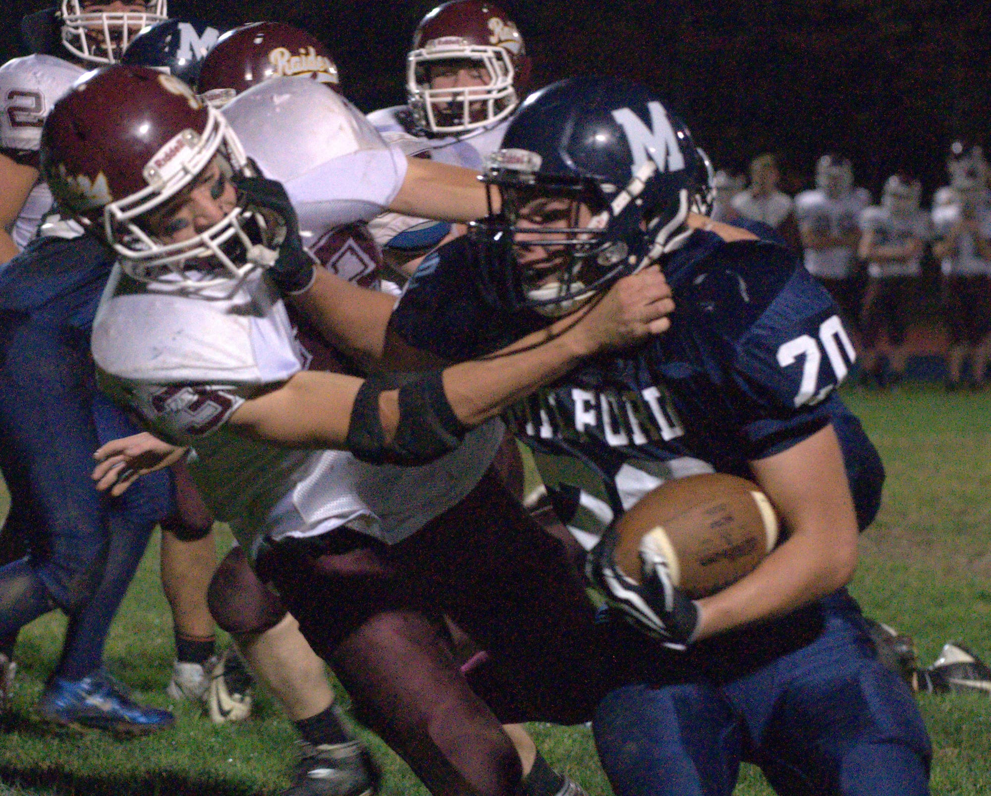 Milford's Mark Madigan tries to fight off a tackle by Lebanon's Cameron Broughton during Friday's game.