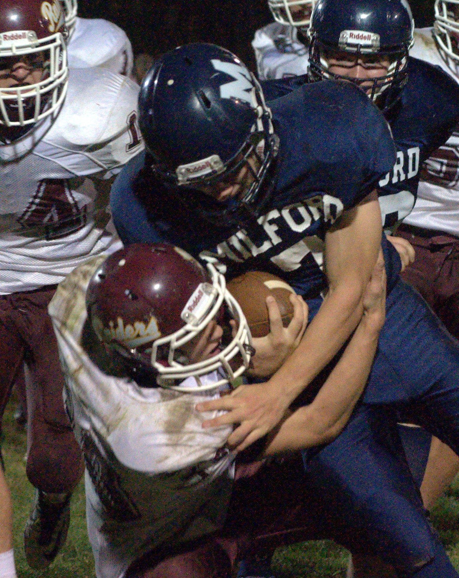 Lebanon's Ryan Milliken brings down Milford's Bryce Walker.
