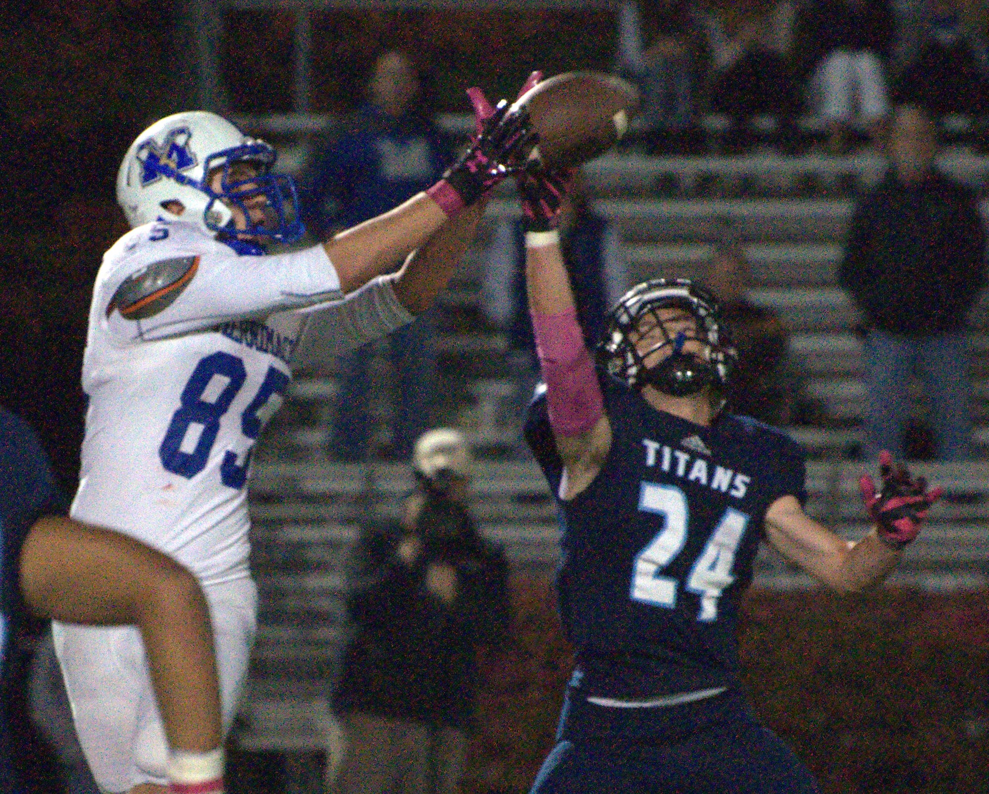 Nashua North's Connor Baldassaro breaks up a pass to Merrimack's Ian Roberts during Thursday's game.