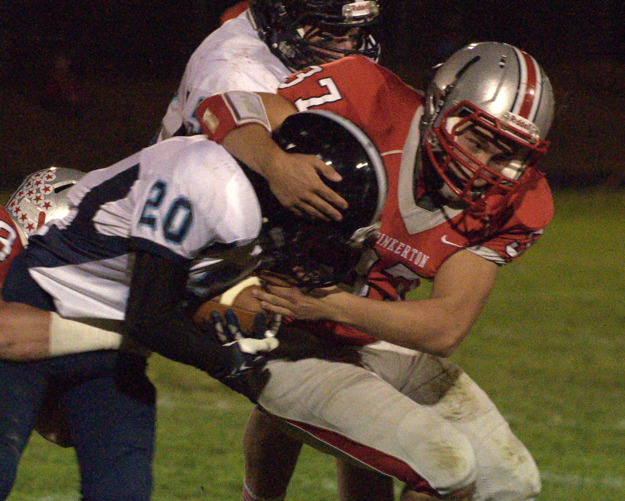 Pinkerton's Matt Allard tackles Nashua North's Dana Salem during Friday's game.