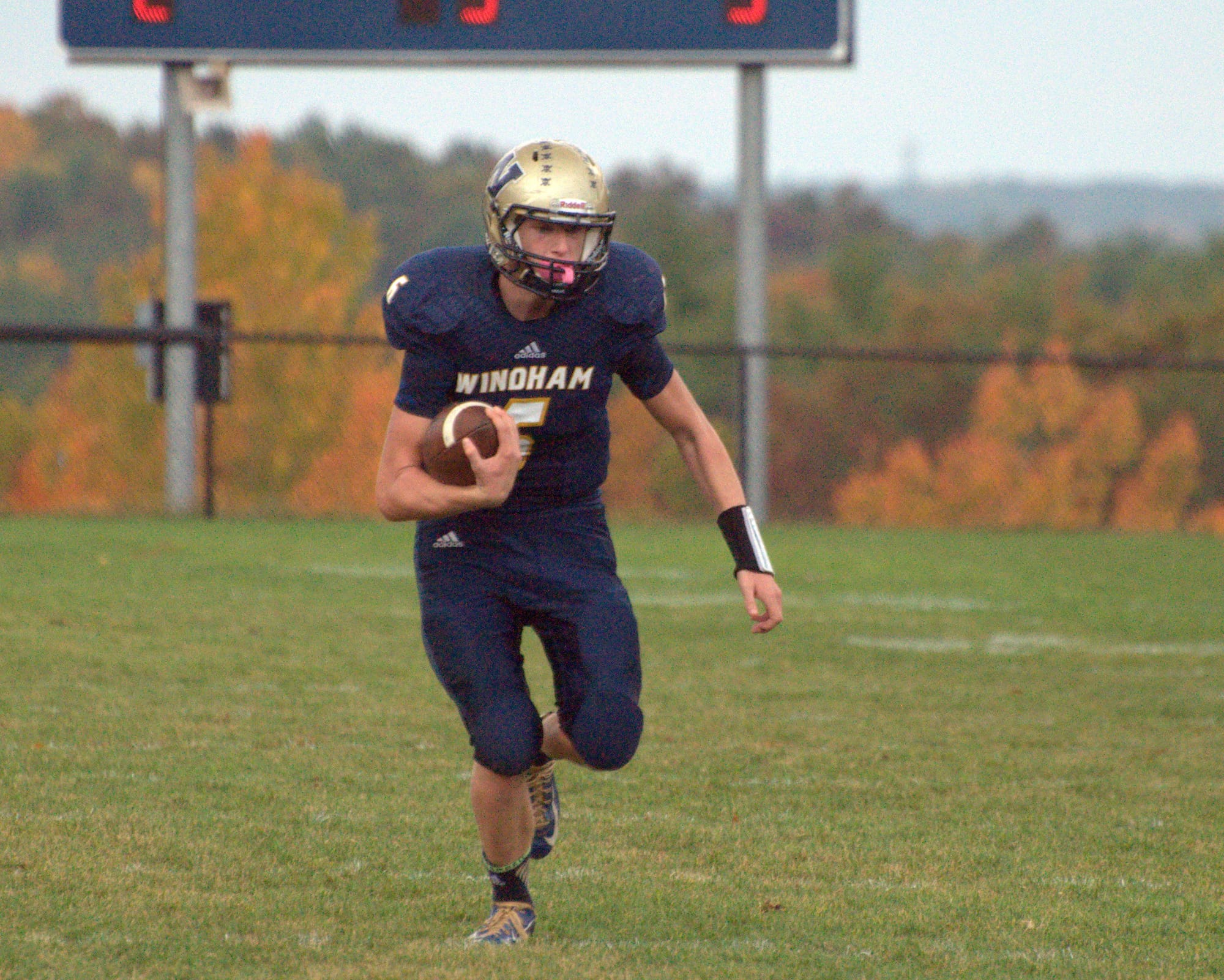 Windham's Kurtis Jolicoeur runs with the ball during Saturday's game against Pelham.
