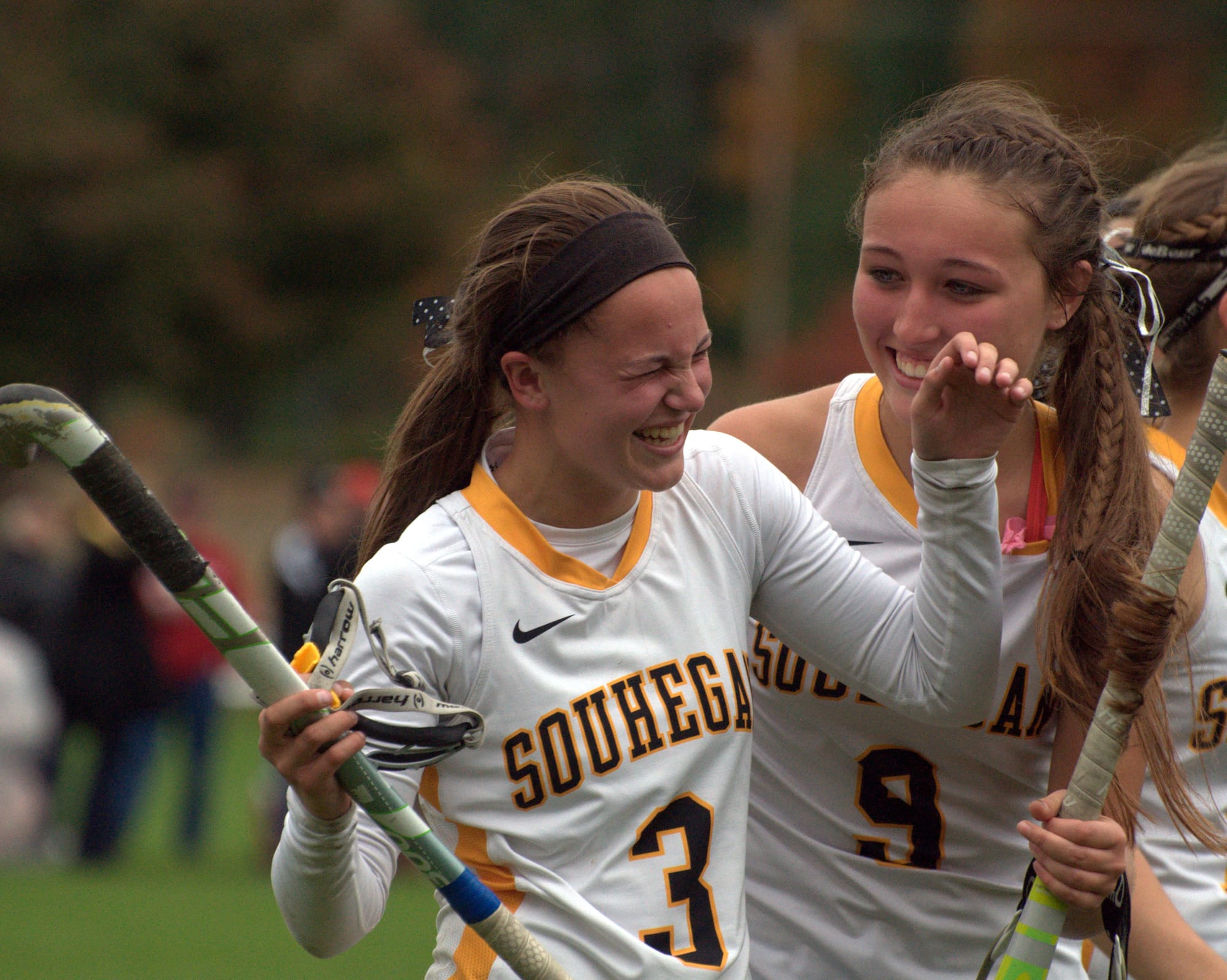 Souhegan's Madi Angulas, left, and Katie Casey celebrate after Friday's win over Portsmouth.