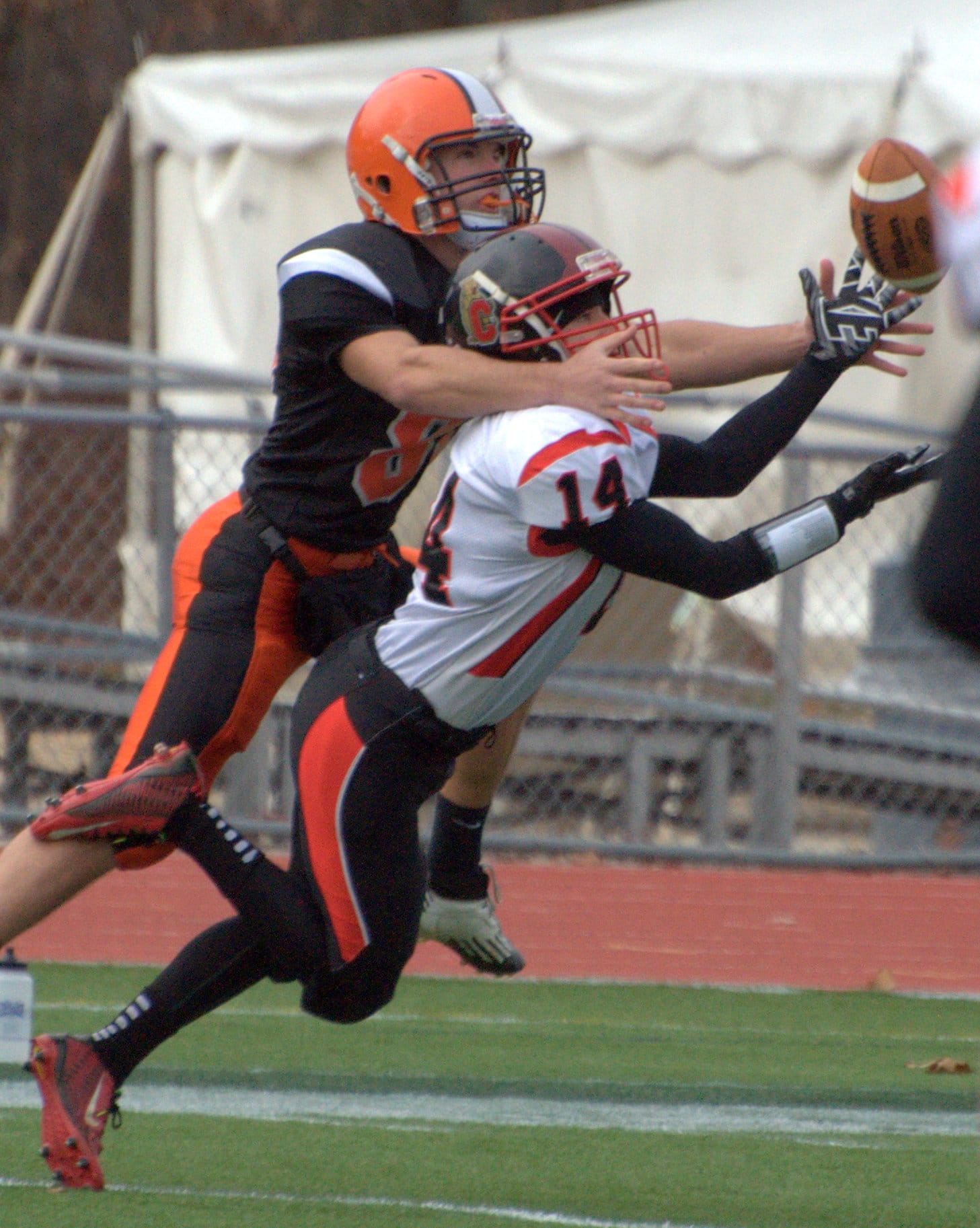 Campbell's Justin DiBenedetto intercepts a pass in front of Newport's Stephan Nix.