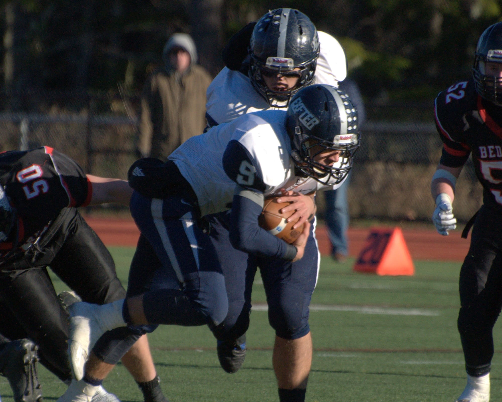 Exeter's Kyle Ball breaks a tackle as he carries the ball.
