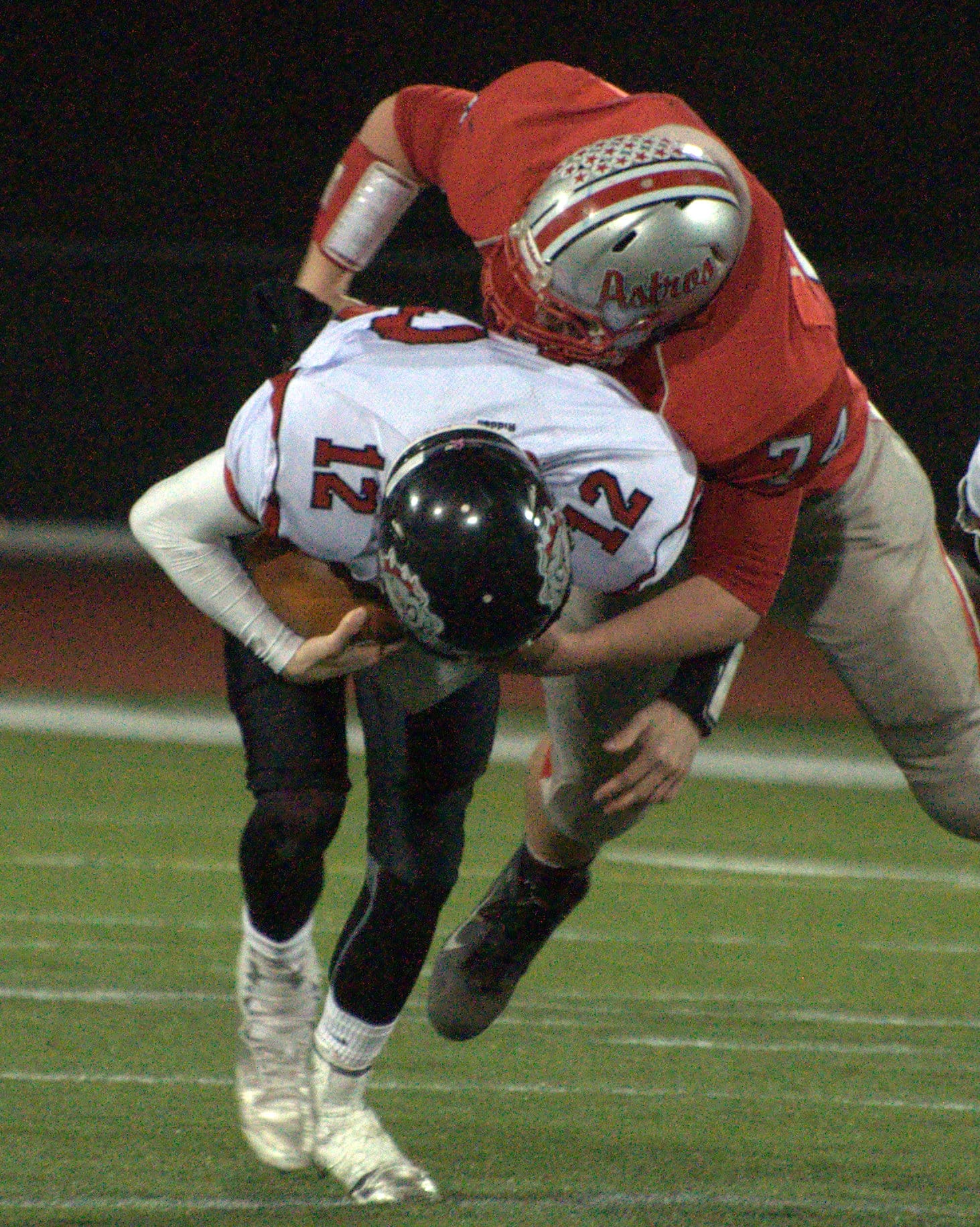 Pinkerton's Bryson Pacocha sacks Bedford's Tyler Cibotti.