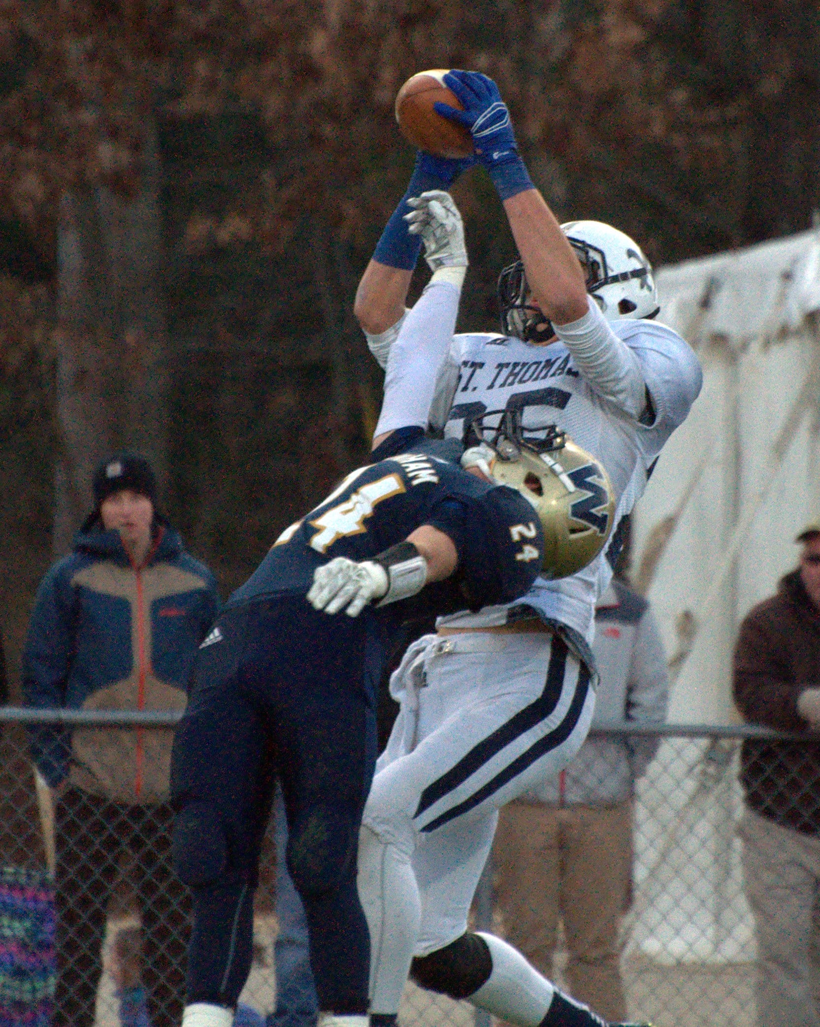 St.Thomas's Liam Middleton hauls in a touchdown pass over Windham's Matt Shea.